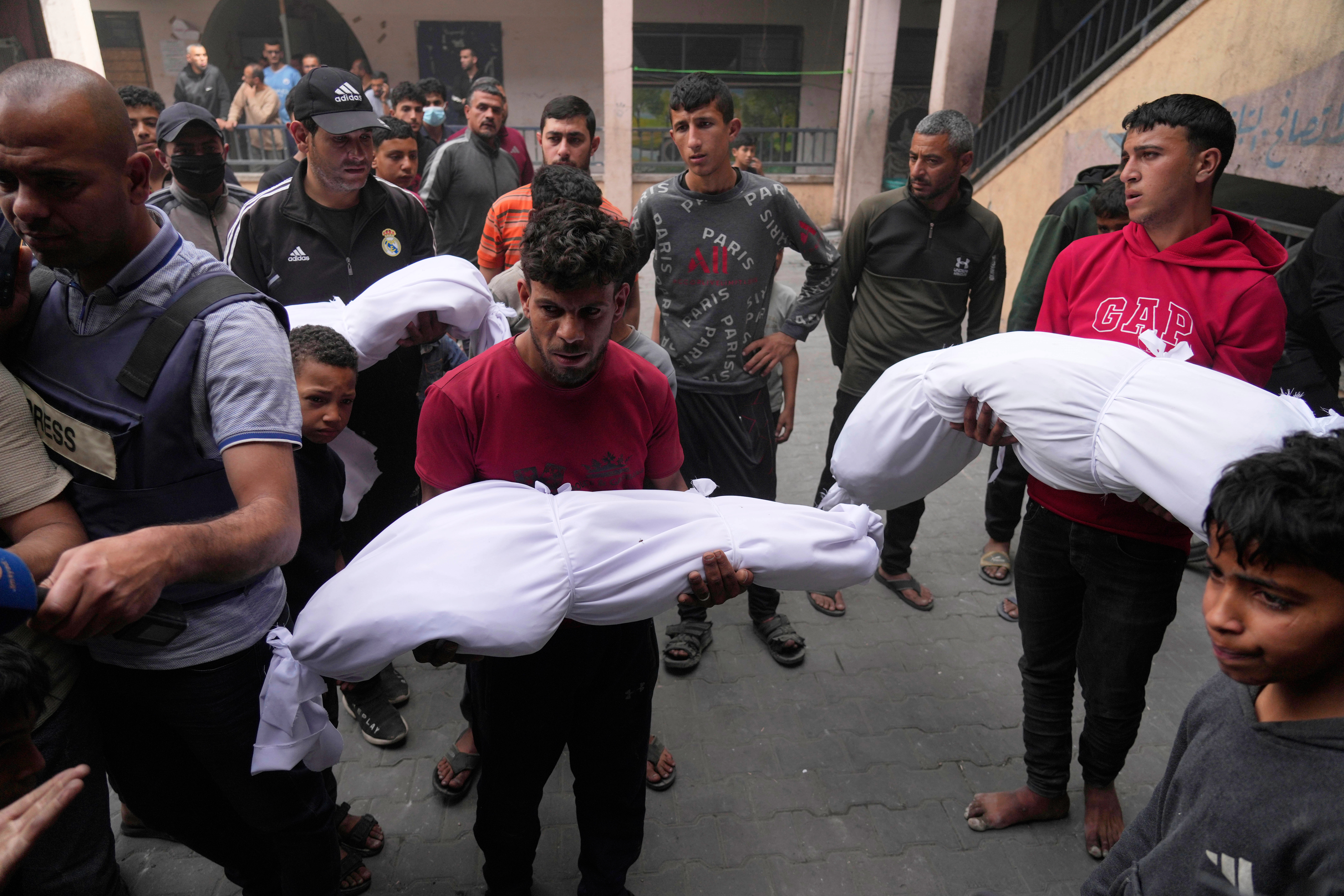 Palestinians bid farewell to their relatives who were killed in Israeli airstrikes early this morning on Yaffa School, in Gaza City, Wednesday, April 23, 2025. (AP Photo/Jehad Alshrafi)
