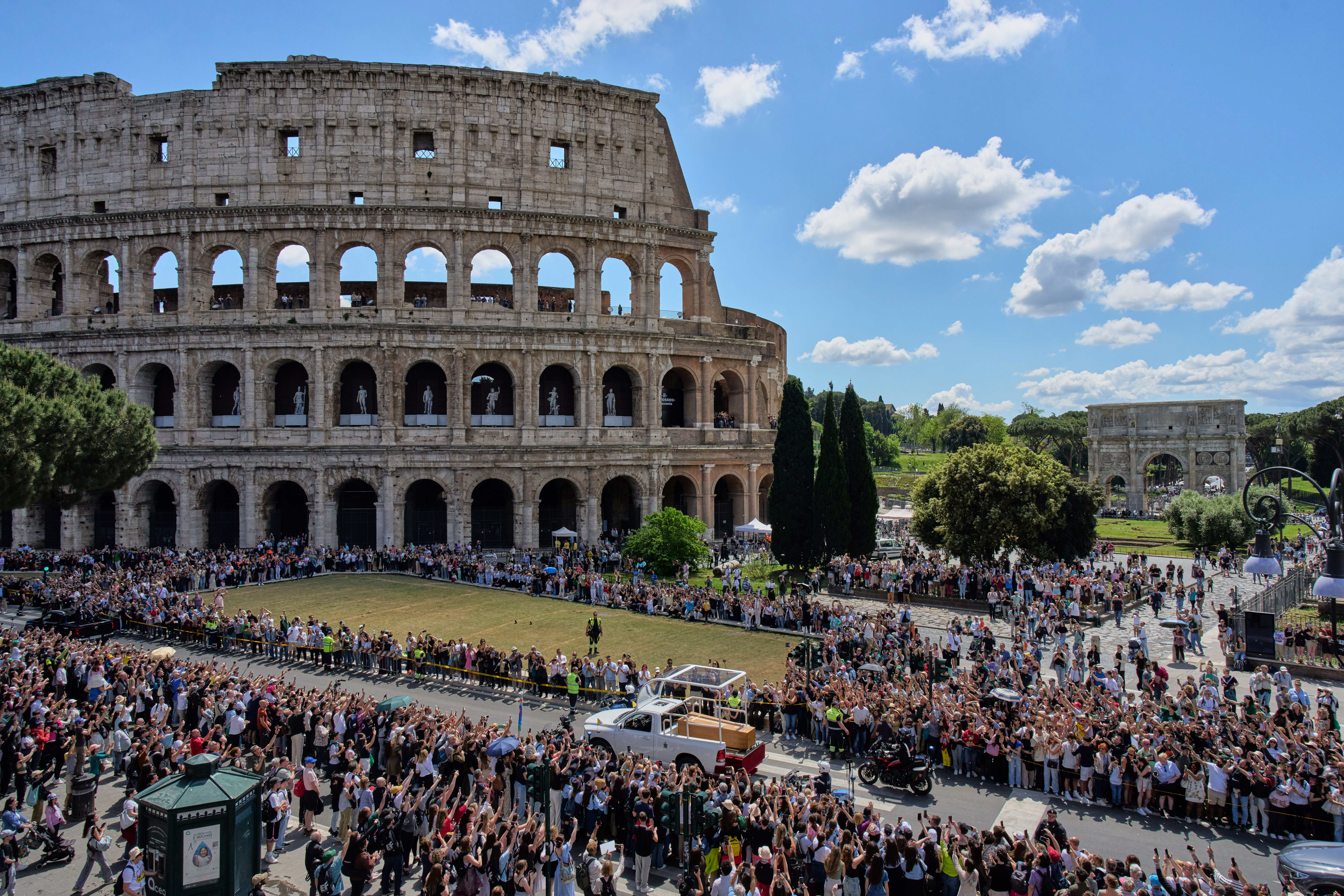 The coffin of Pope Francis passes the Colosseum in Rome