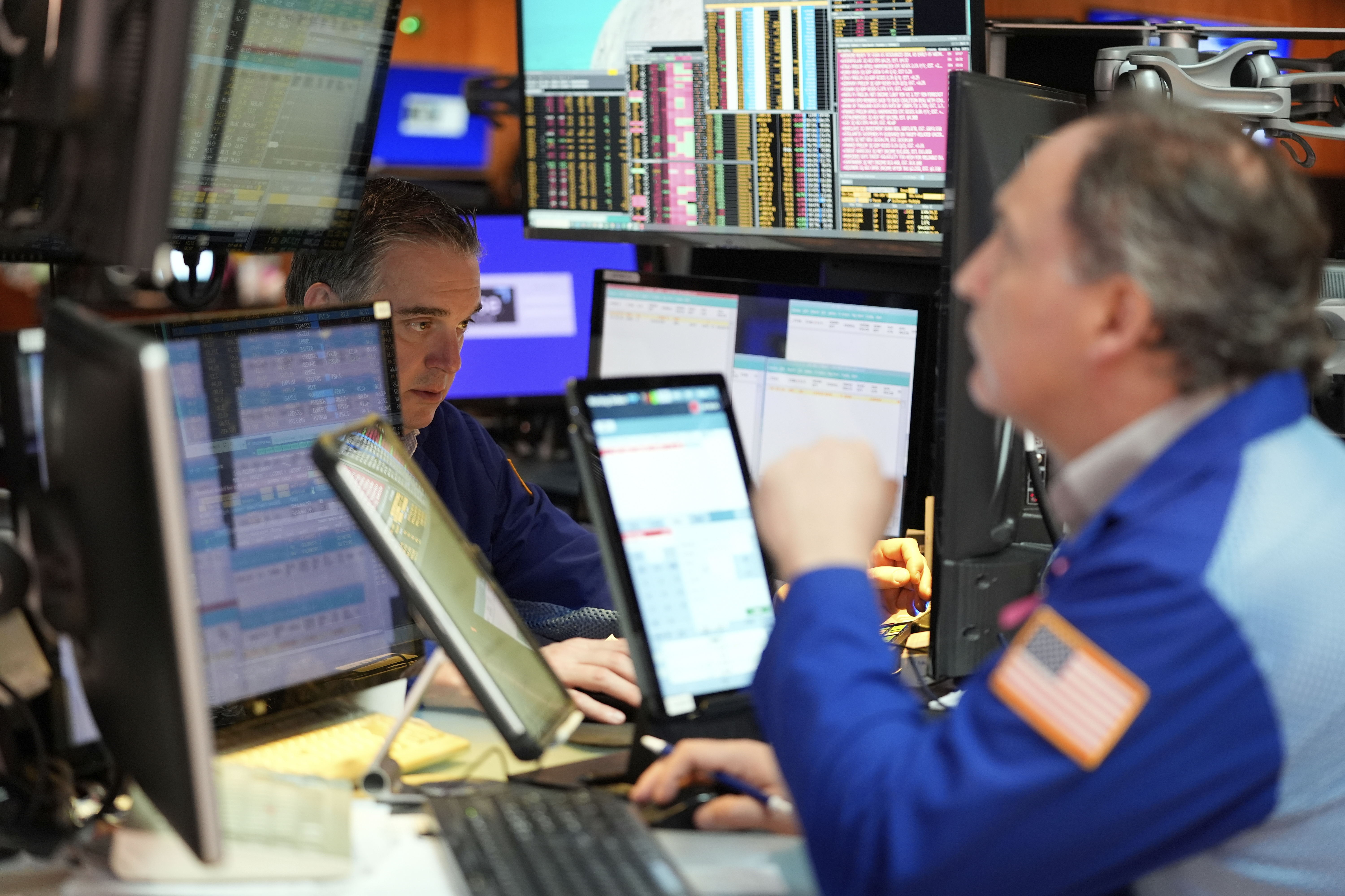 Traders work on the floor at the New York Stock Exchange in New York, Wednesday, April 30, 2025. (AP Photo/Seth Wenig)