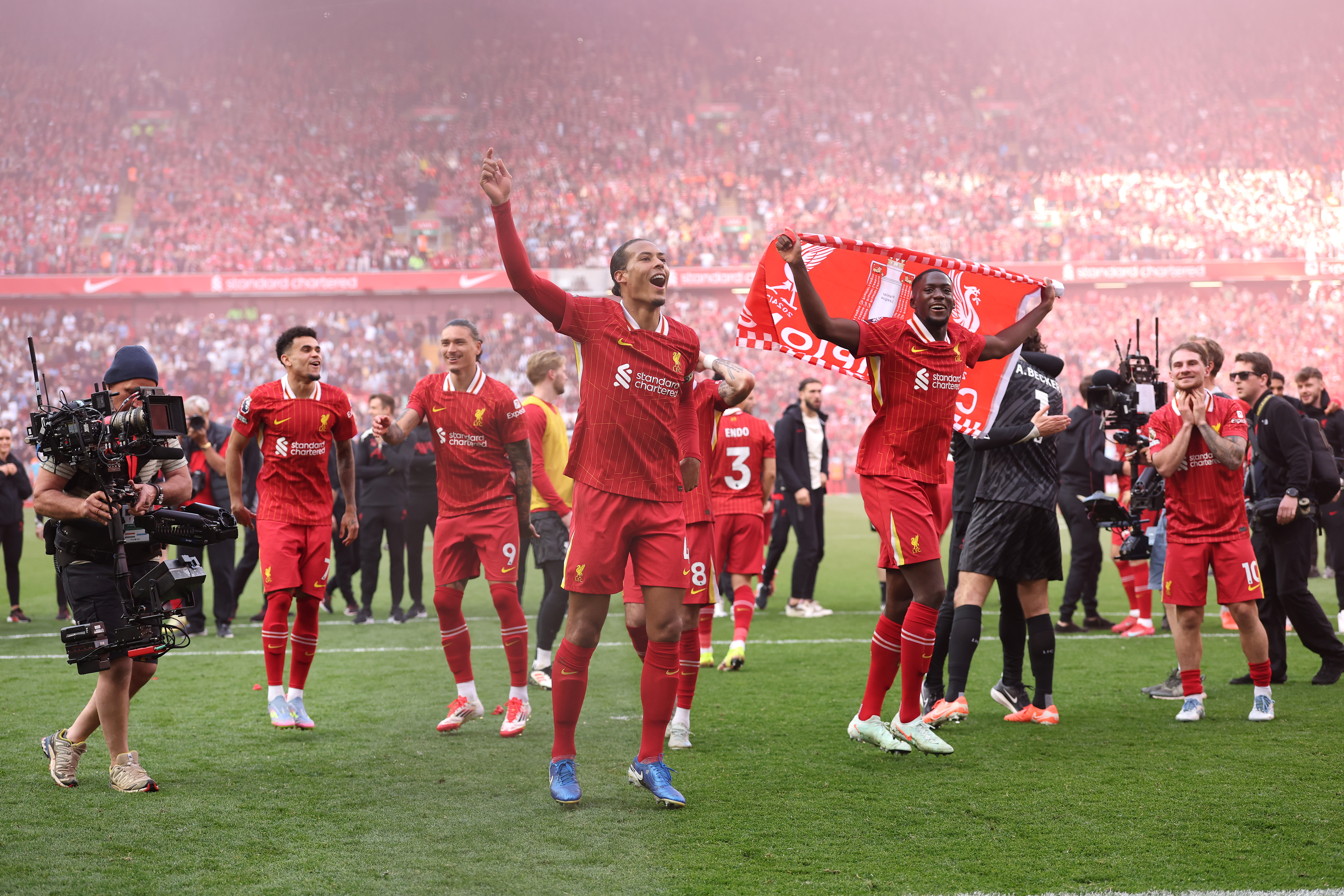 LIVERPOOL, ENGLAND - APRIL 27: Virgil van Dijk of Liverpool leads the celebrates with his teammates, after confirmation of winning the Premier League title in the Premier League match between Liverpool FC and Tottenham Hotspur FC at Anfield on April 27, 2025 in Liverpool, England. (Photo by Carl Recine/Getty Images)