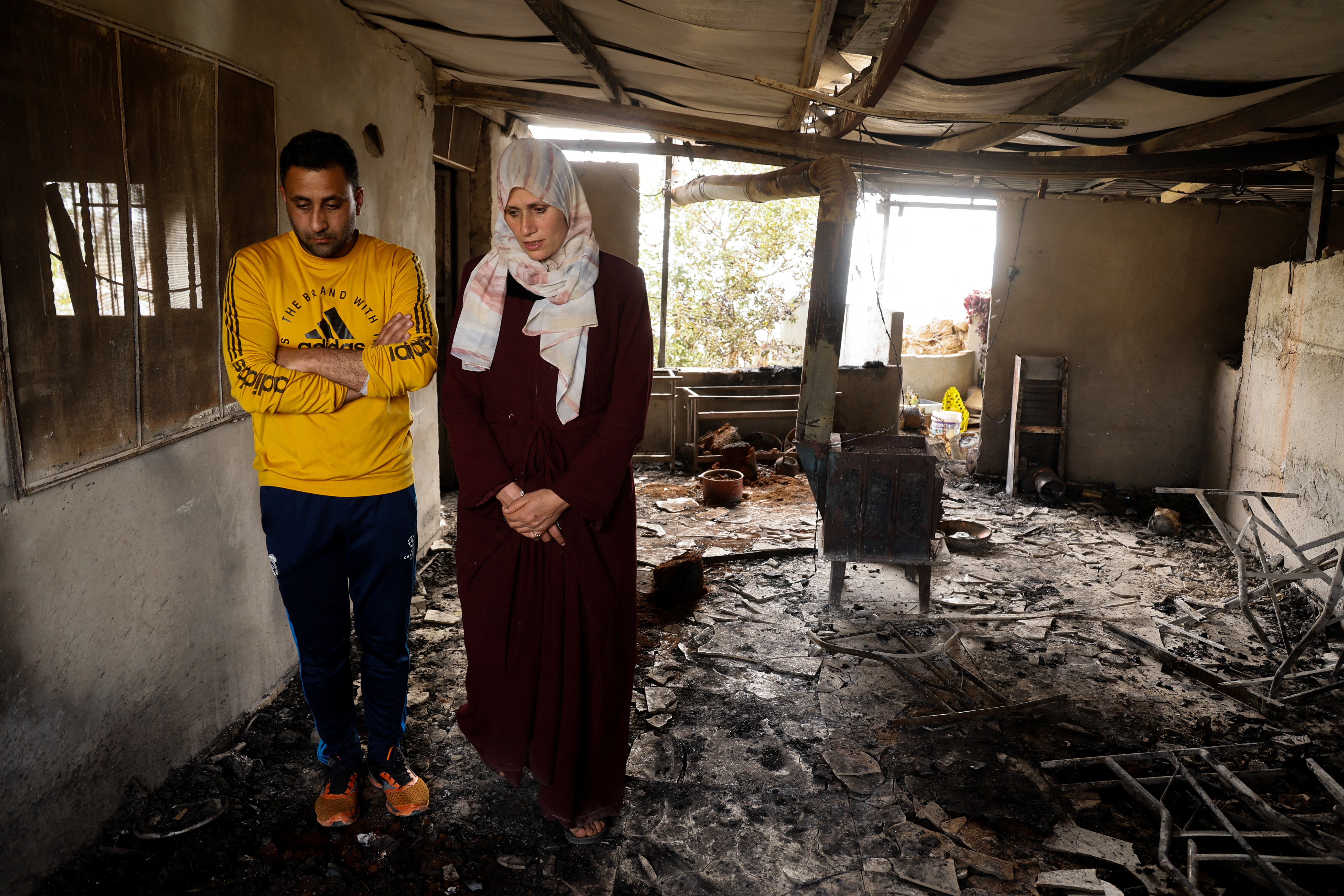 Palestinians in a damaged building.