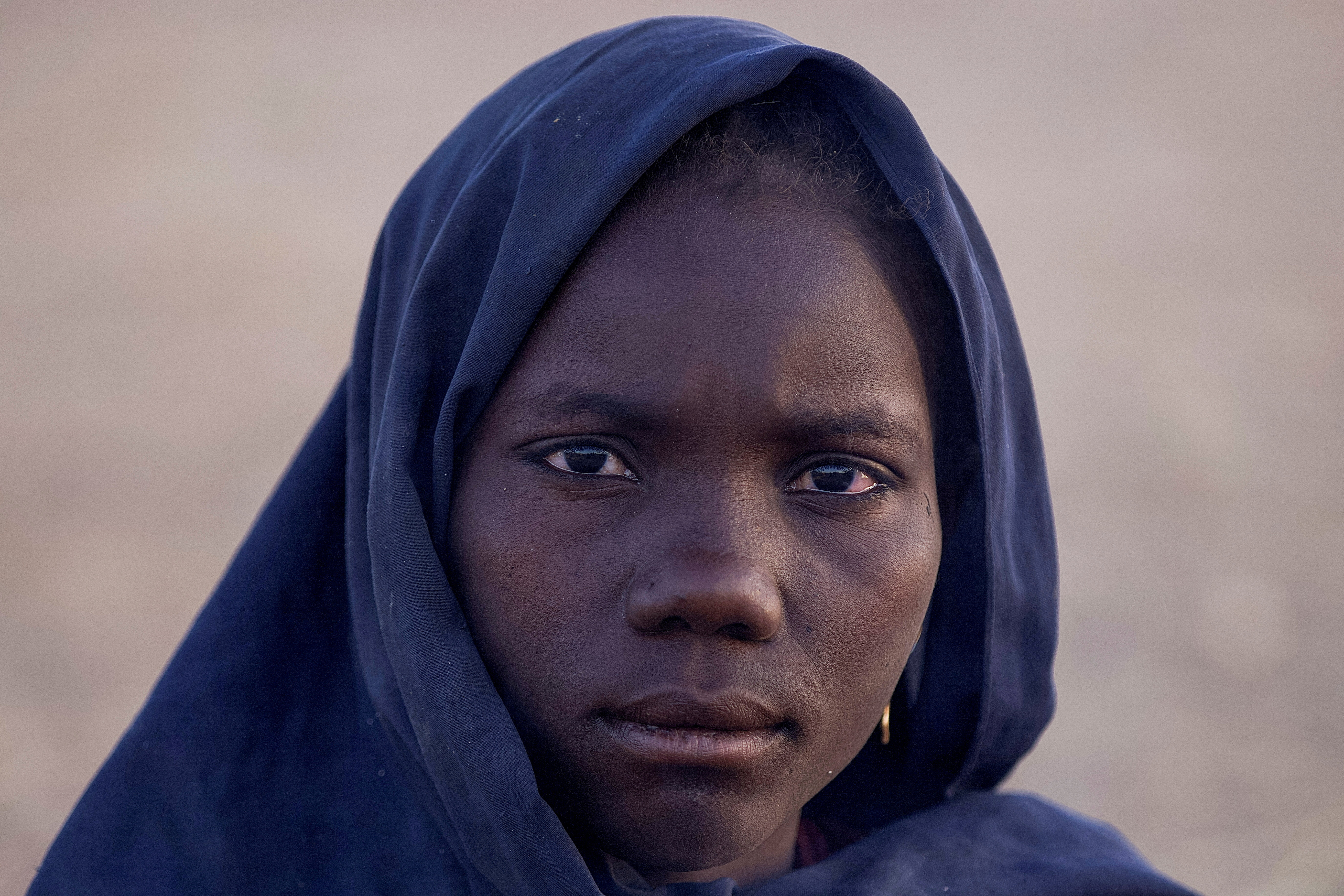 A displaced woman looks on, following Rapid Support Forces (RSF) attacks on Zamzam displacement camp, as she shelters in the town of Tawila, North Darfur, Sudan, April 16, 2025. REUTERS/Stringer TPX IMAGES OF THE DAY