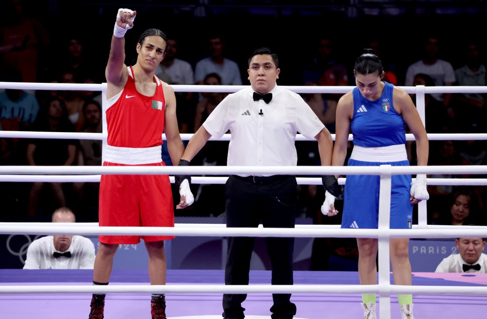 epa11756164 Imane Khelif (L) of Algeria is declared the winner after Angela Carini of Italy abandoned their bout in the Women 66kg preliminaries round of 16 in the Boxing competitions in the Paris 2024 Olympic Games, at the North Paris Arena in Villepinte, France, 01 August 2024. EPA-EFE/YAHYA ARHAB