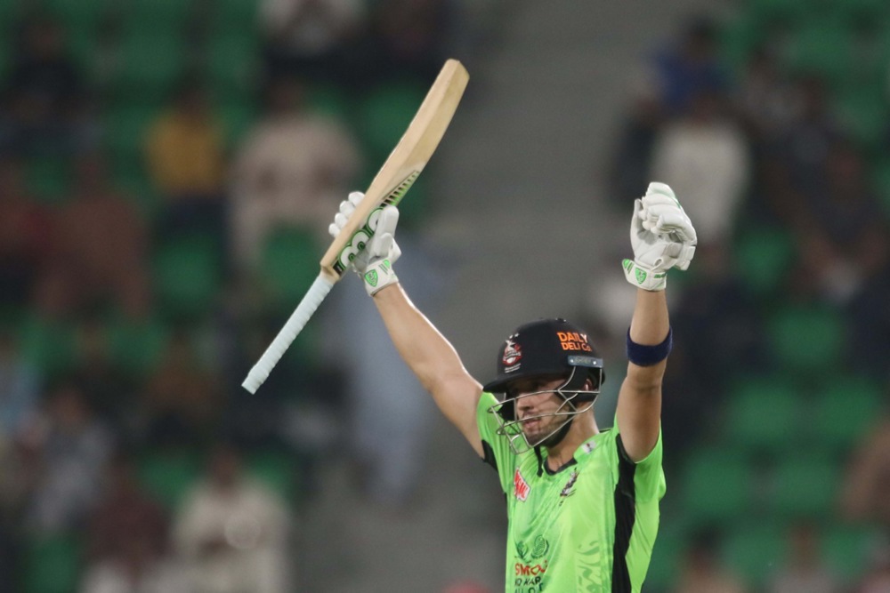 Lahore Qalanders player Muhammad Naeem celebrates after completing a half-century during a Pakistan Super League T20 cricket match between Islamabad United