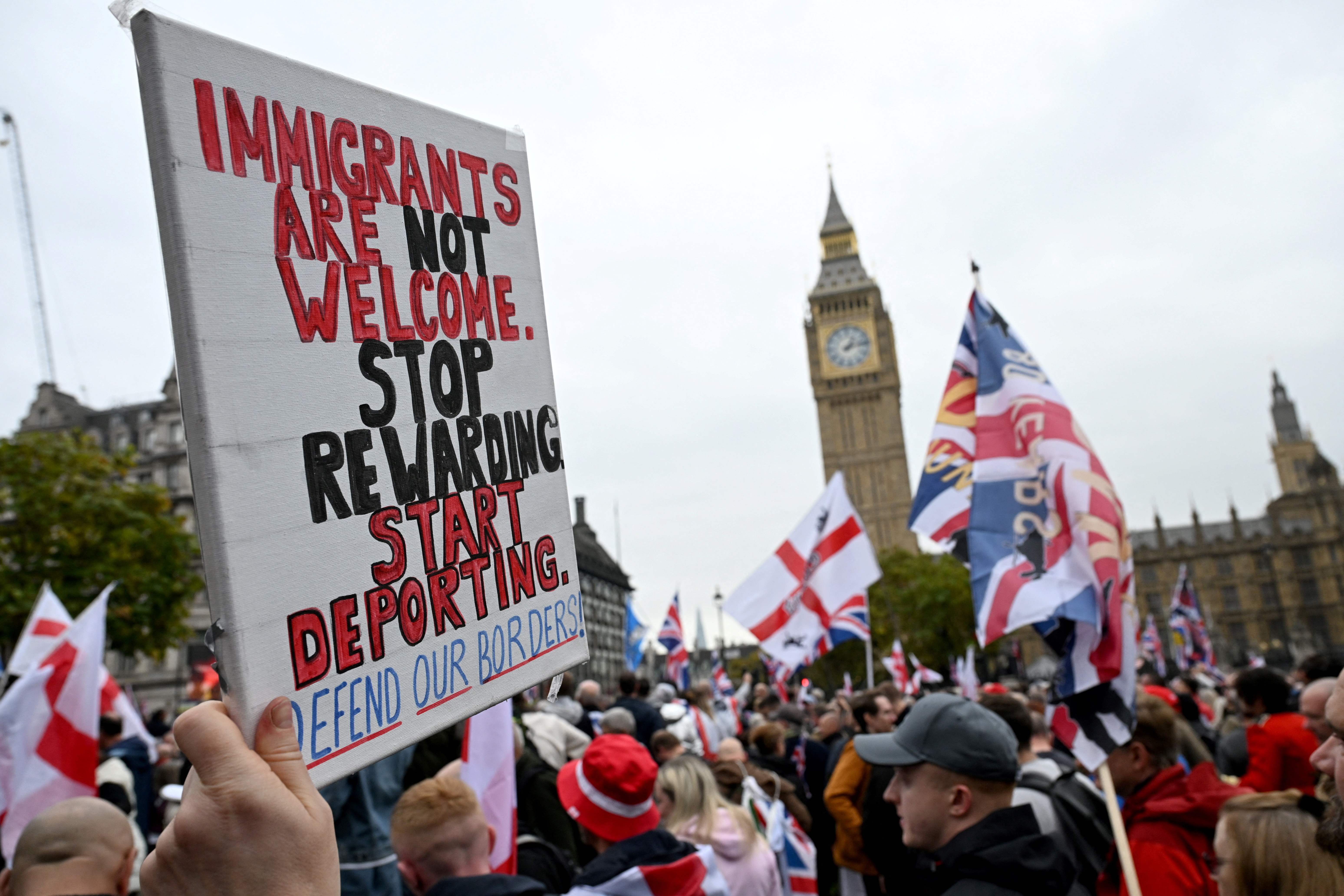 People attend an anti-immigration protest, in London