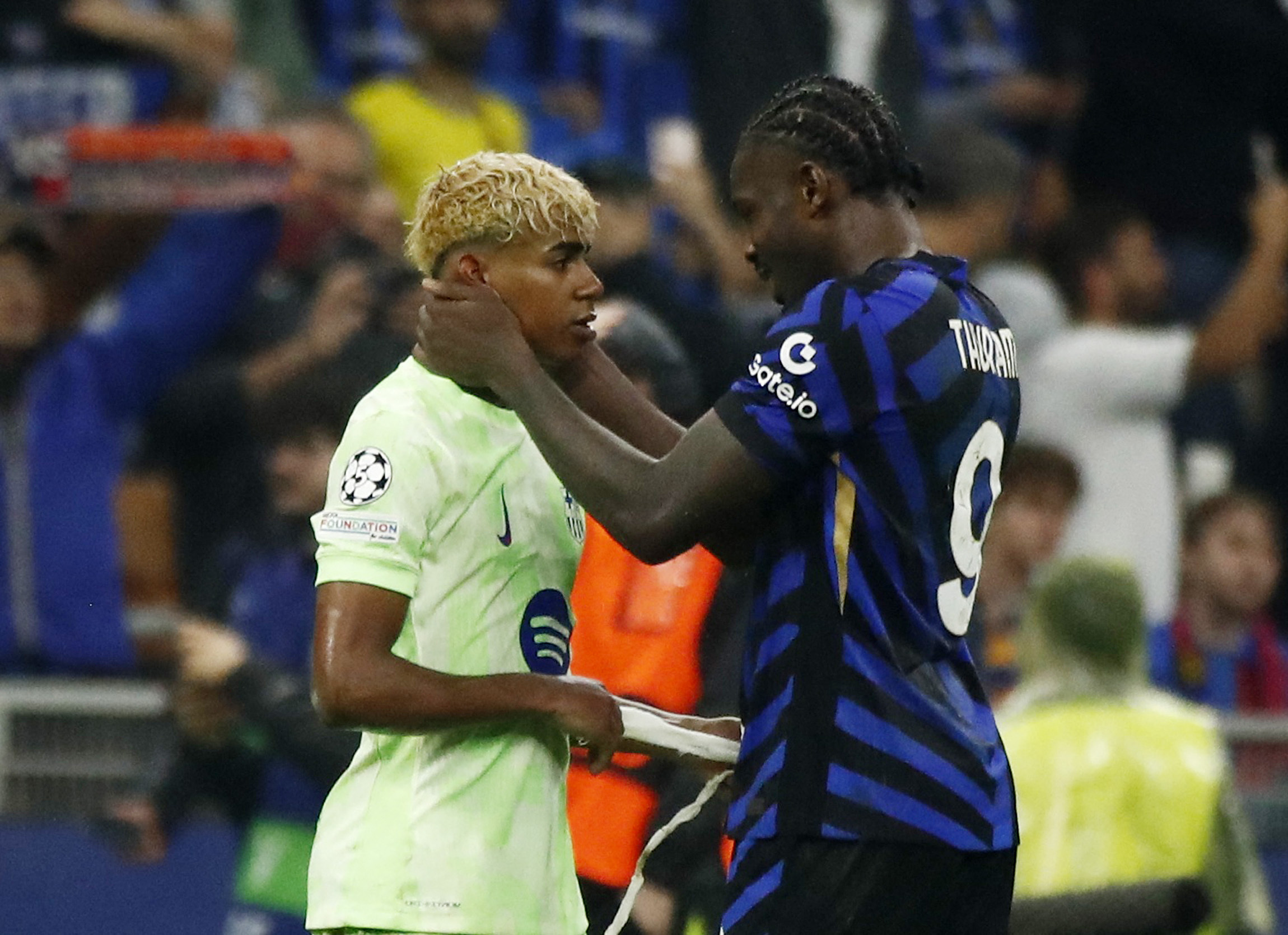 Soccer Football - Champions League - Semi Final - Second Leg - Inter Milan v FC Barcelona - San Siro, Milan, Italy - May 6, 2025 FC Barcelona's Lamine Yamal and Inter Milan's Marcus Thuram after the match REUTERS/Alessandro Garofalo