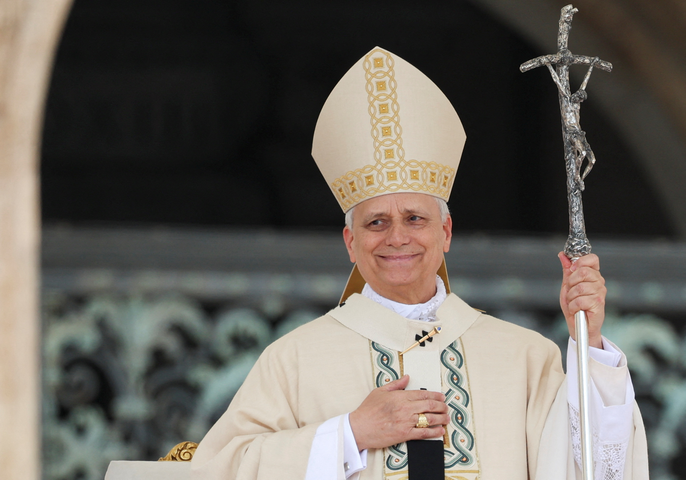 Pope Leo XIV gestures at the end of his inaugural Mass in Saint Peter’s Square.