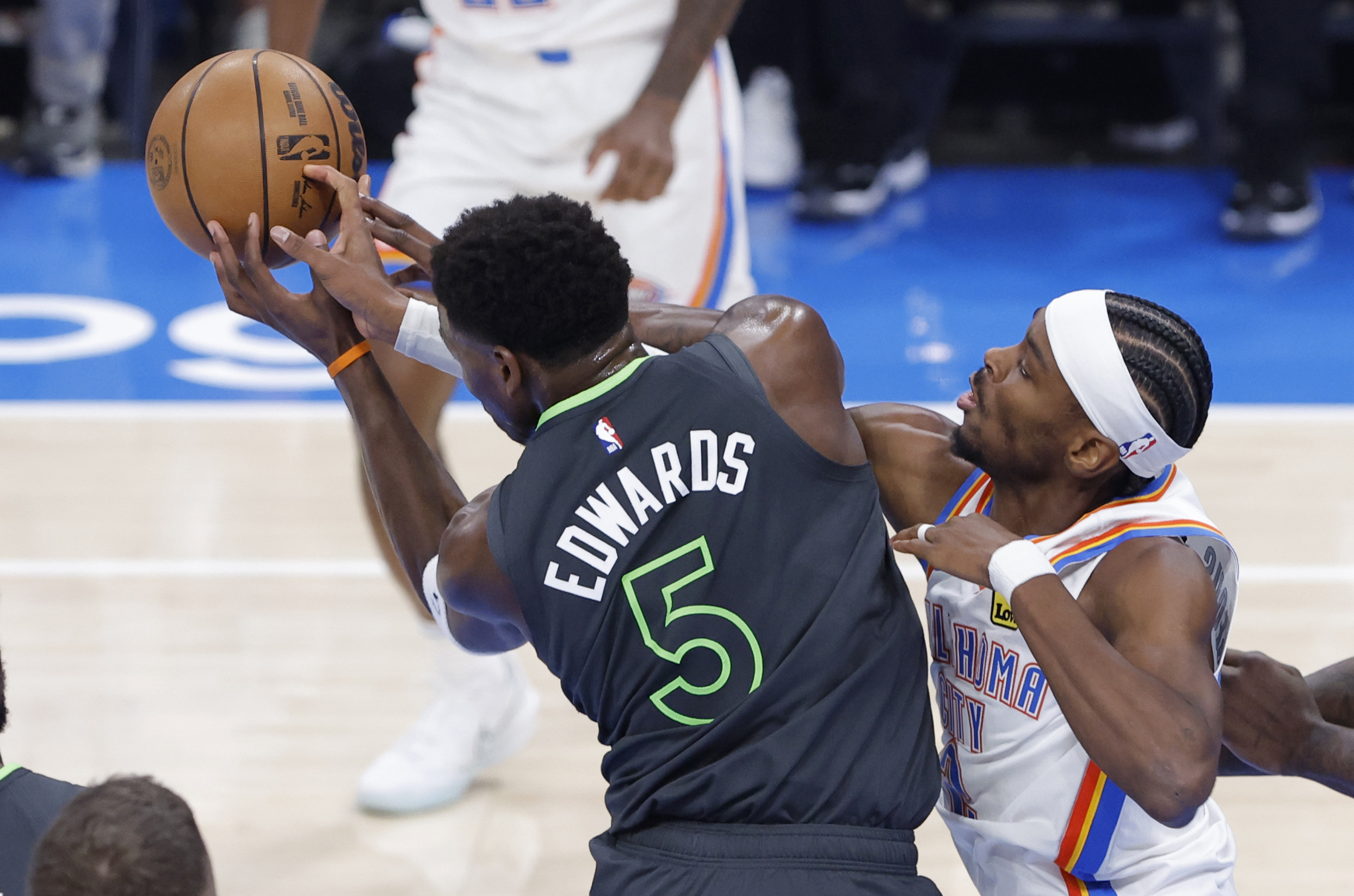 Shai Gilgeous-Alexander and Anthony Edwards in action.