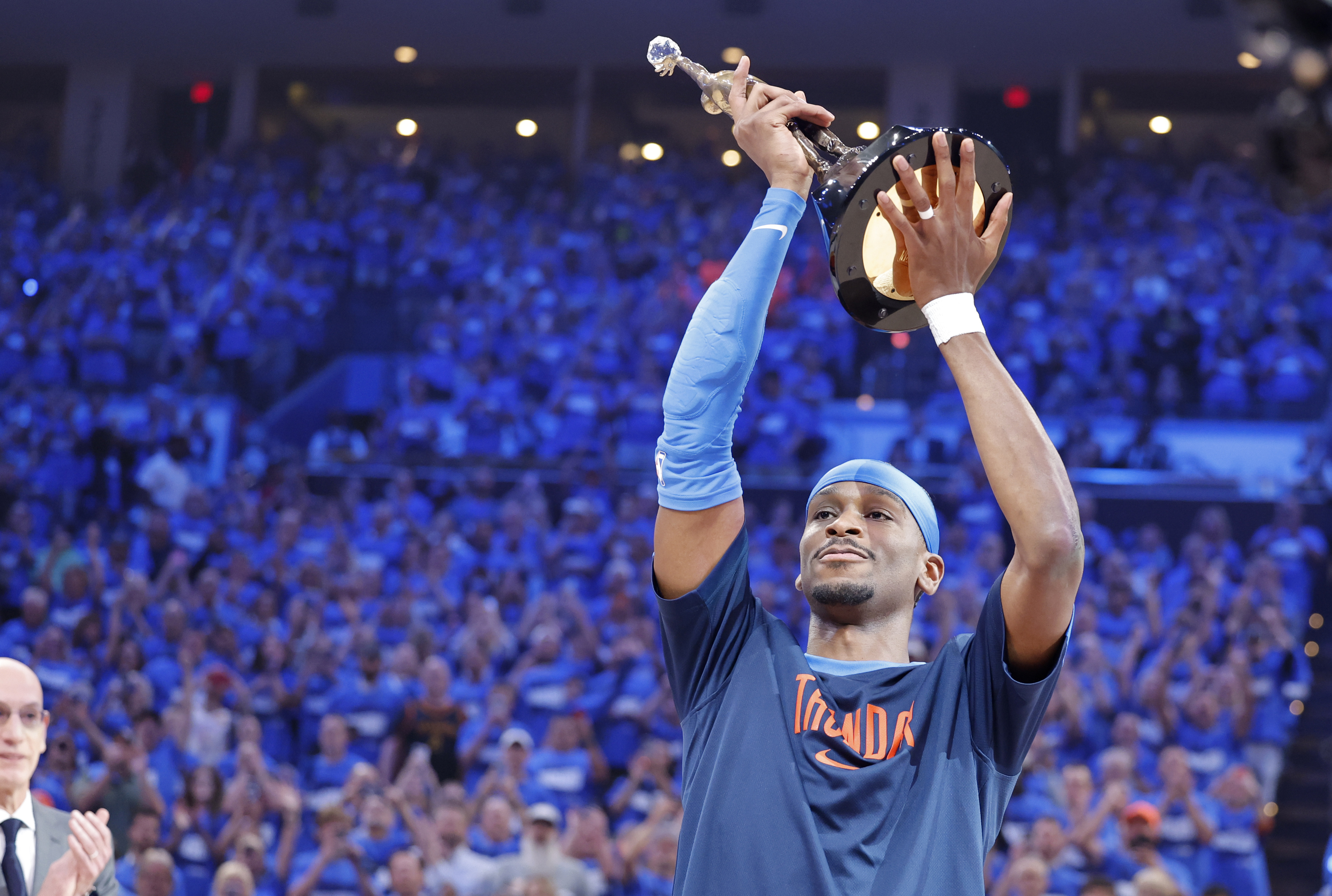 Oklahoma City Thunder guard Shai Gilgeous-Alexander with the Michael Jordan Trophy for winning the most valuable player award for the 2024-25 season before game two of the western conference finals for the 2025 NBA Playoffs
