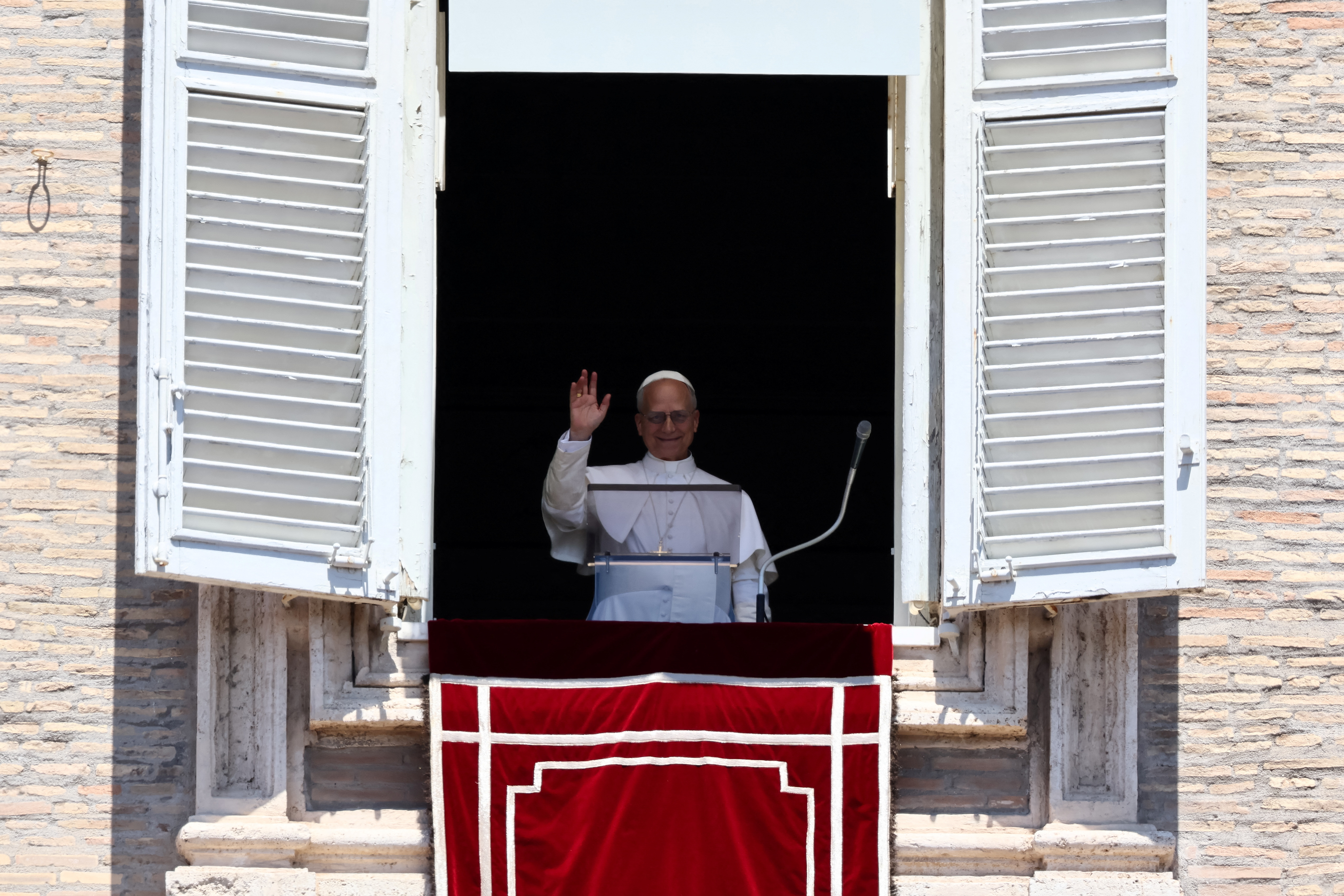 Pope Leo XIV leads the Regina Caeli prayer from his window in St. Peter's Square, at the Vatican, May 25, 2025. REUTERS/Vincenzo Livieri