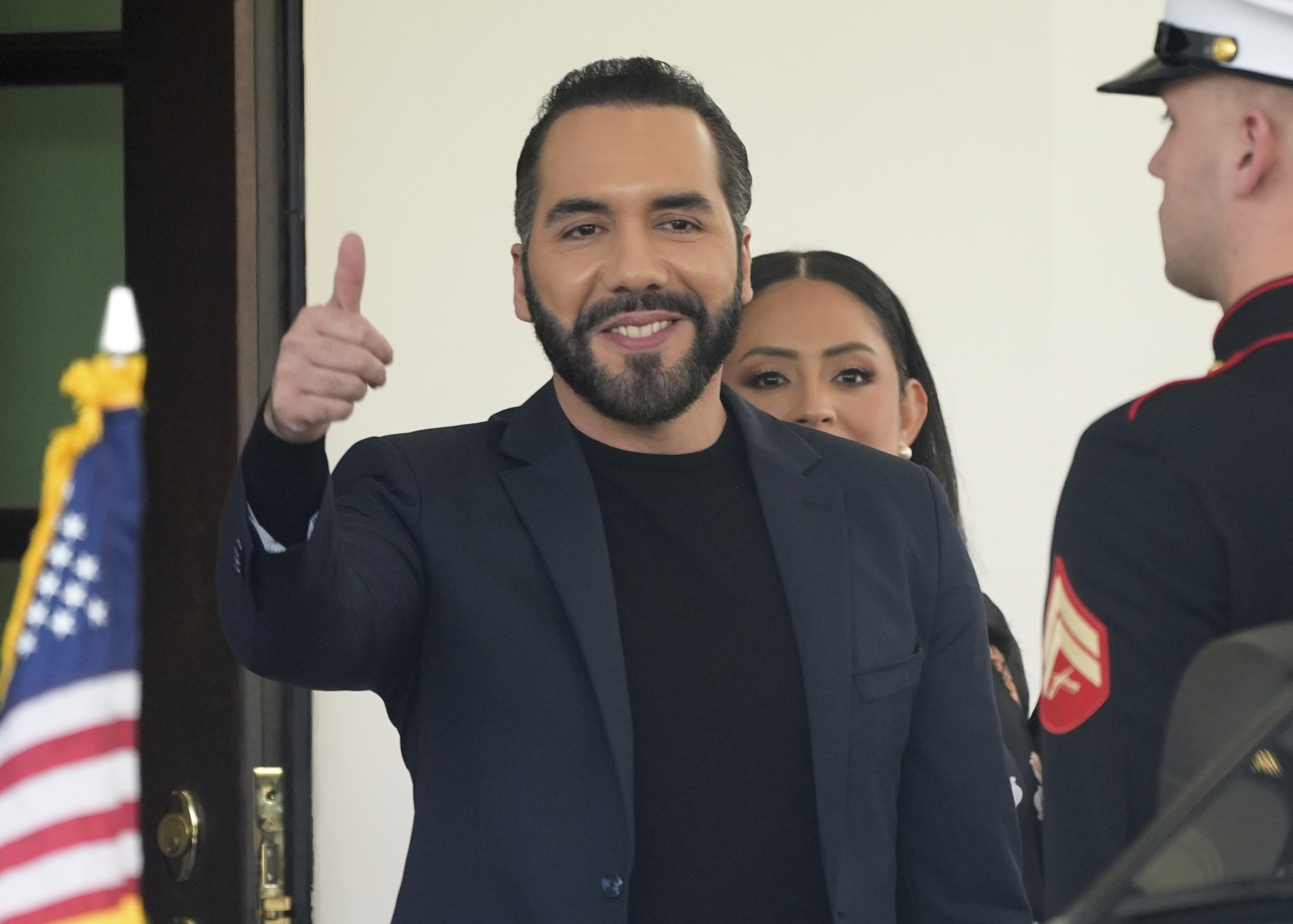 Nayib Bukele flashes a thumbs-up outside the White House.