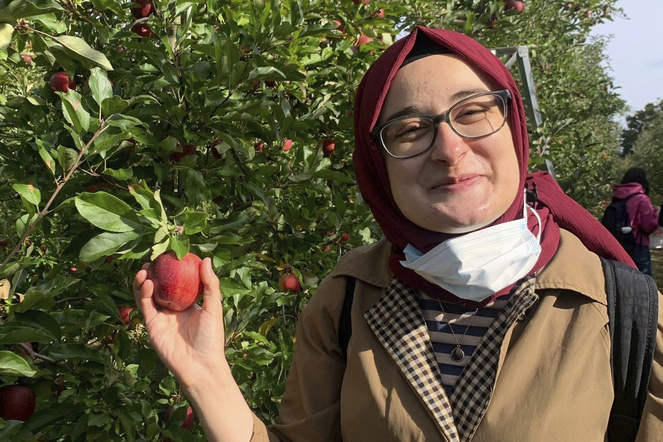 Rumeysa Ozturk holds an apple.