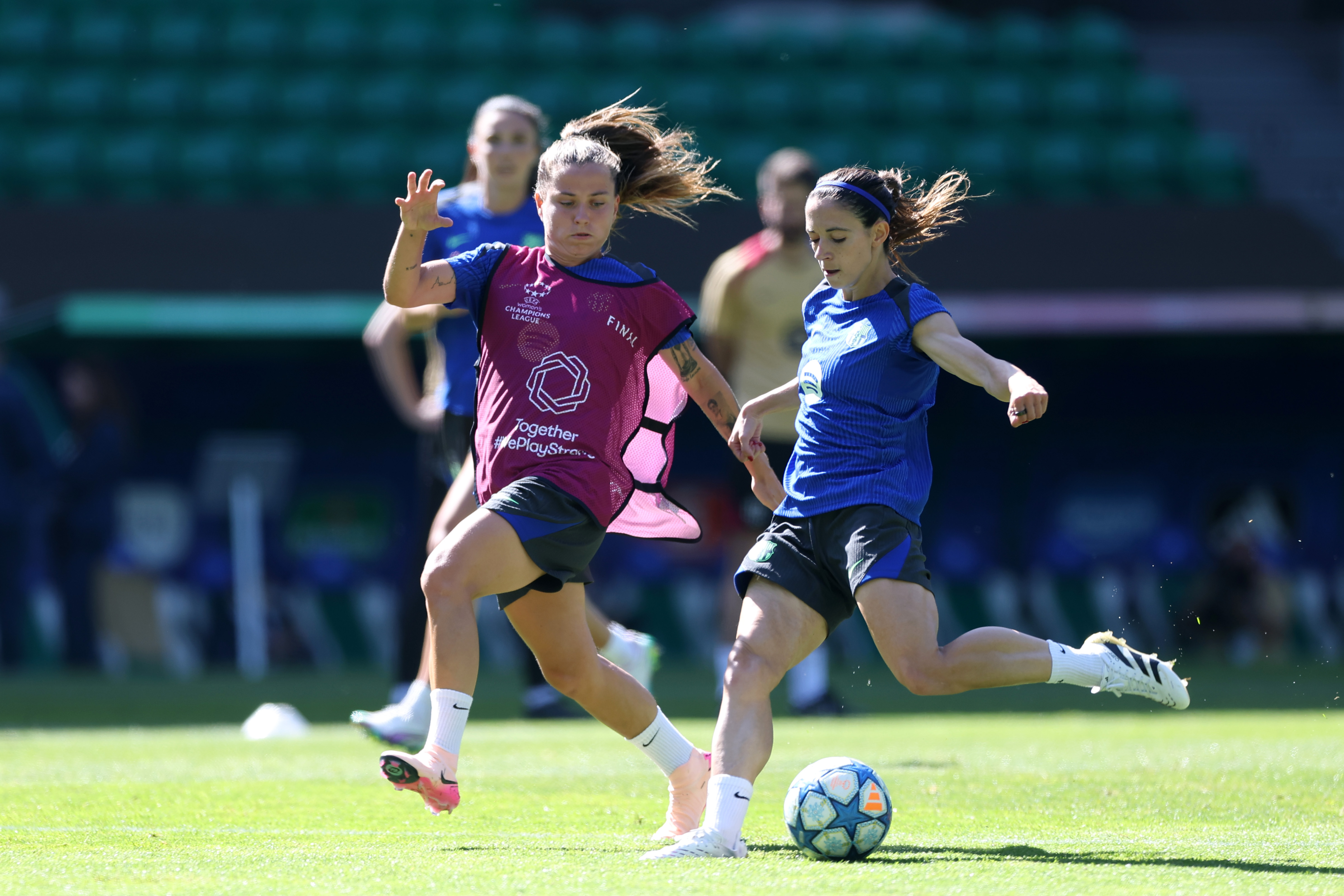 Claudia Pina (L) and Aitana Bonmati of Barcelona during a training session ahead of the UEFA Women's Champions League Final 2025 against Arsenal