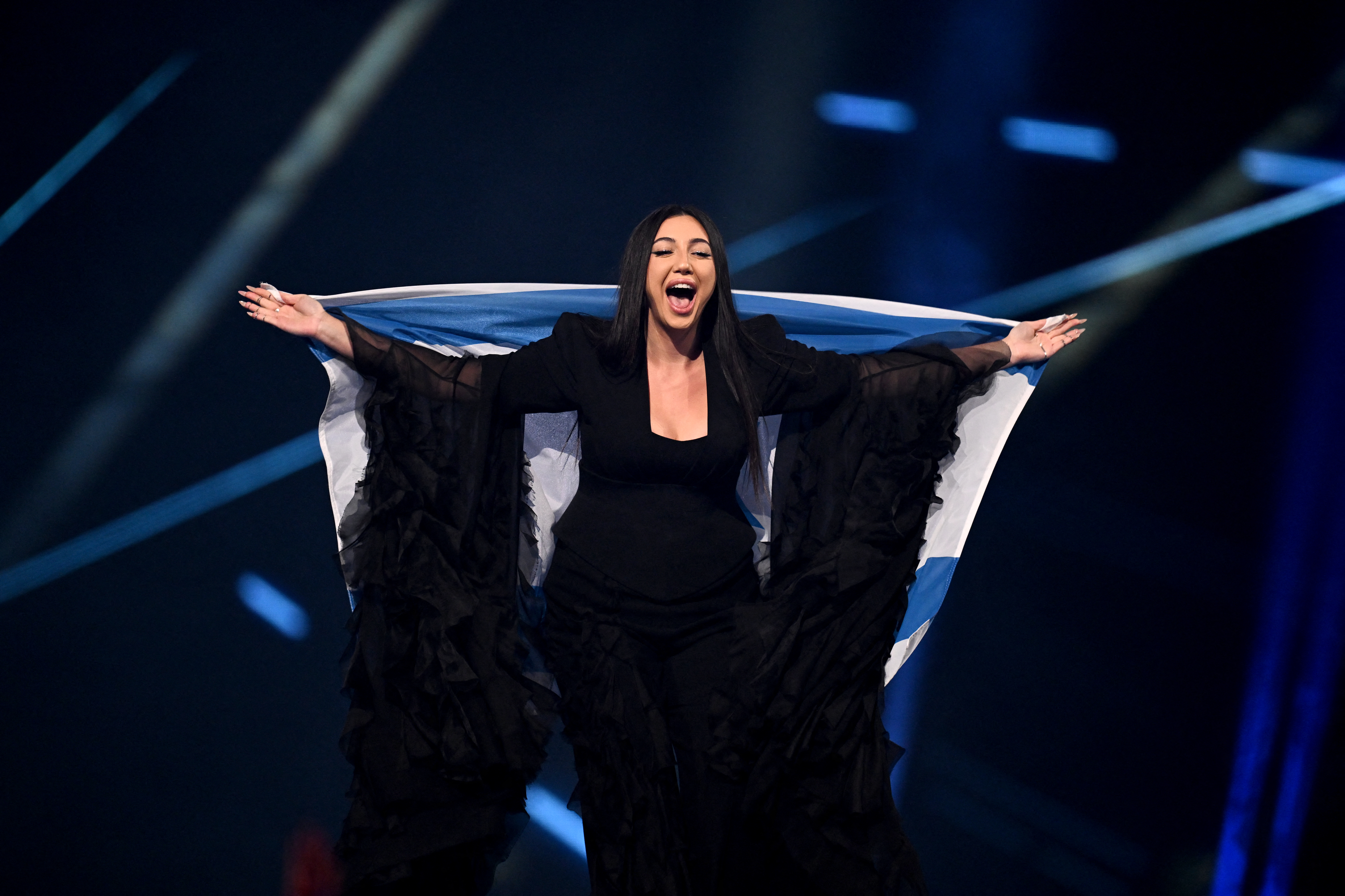Israeli singer Yuval Raphael representing Israel with the song "New Day Will Rise" parades during the flag ceremony prior to the grand final of the Eurovision Song Contest 2025, at the St. Jakobshalle arena in Basel on May 17, 2025. (Photo by Fabrice COFFRINI / AFP)