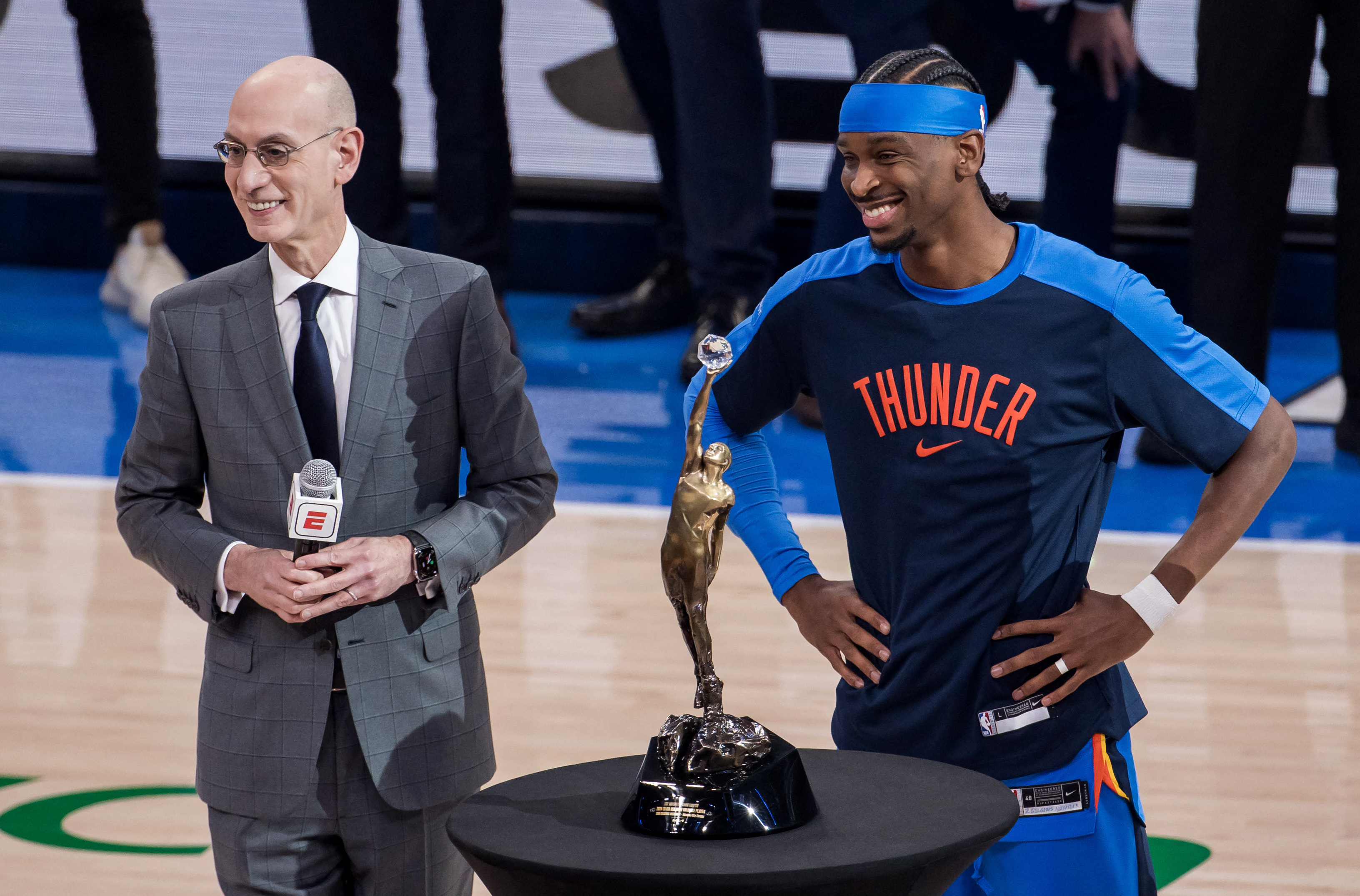 NBA commissioner Adam Silver, left, on court at Oklahoma City to present Shai Gilgeous-Alexander with a trophy.