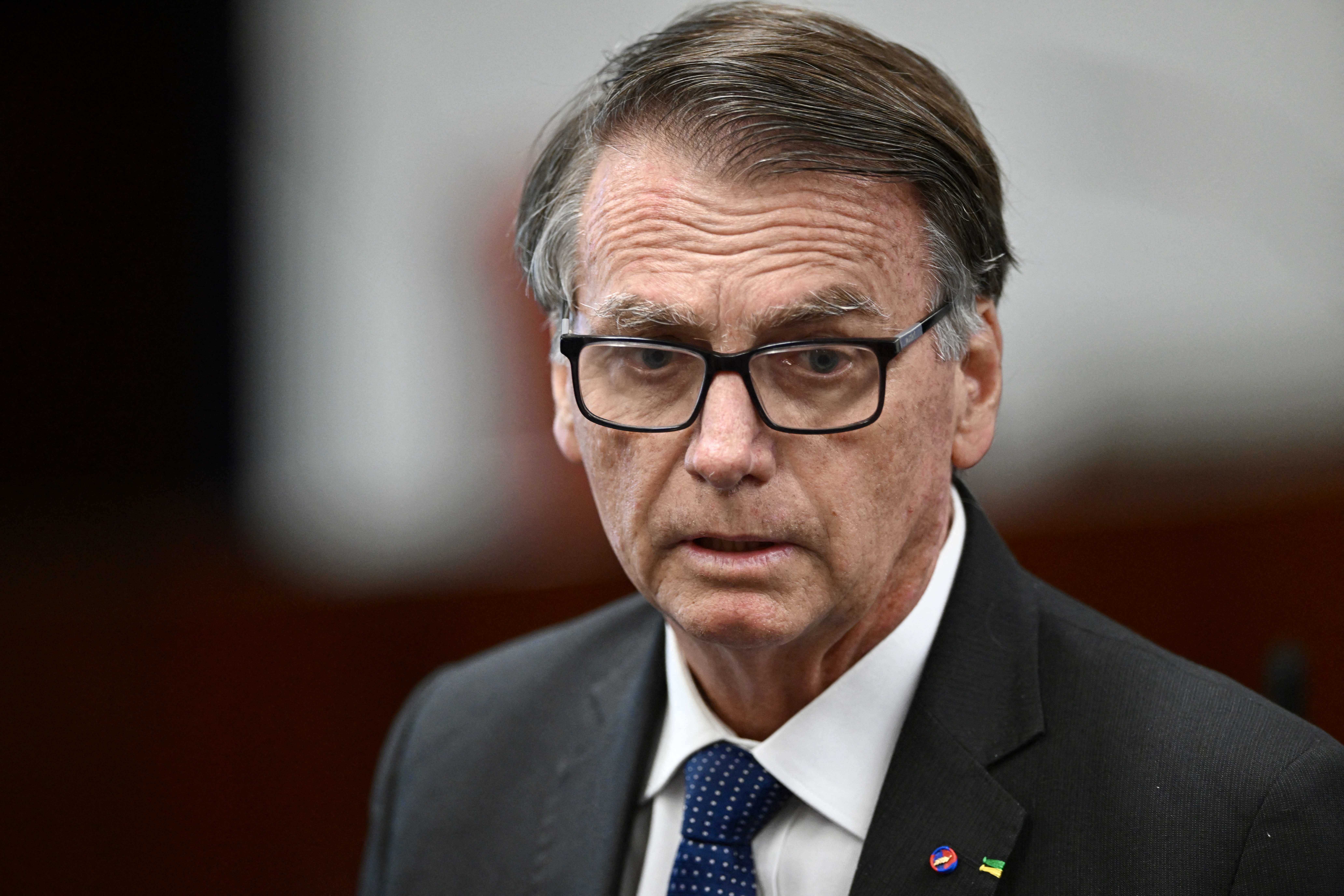 Former Brazilian president Jair Bolsonaro attends a session of the Brazilian Supreme Court to take the stand for in-person questioning of those accused of the attempted coup d'état in January 2023, in Brasilia on June 10, 2025.