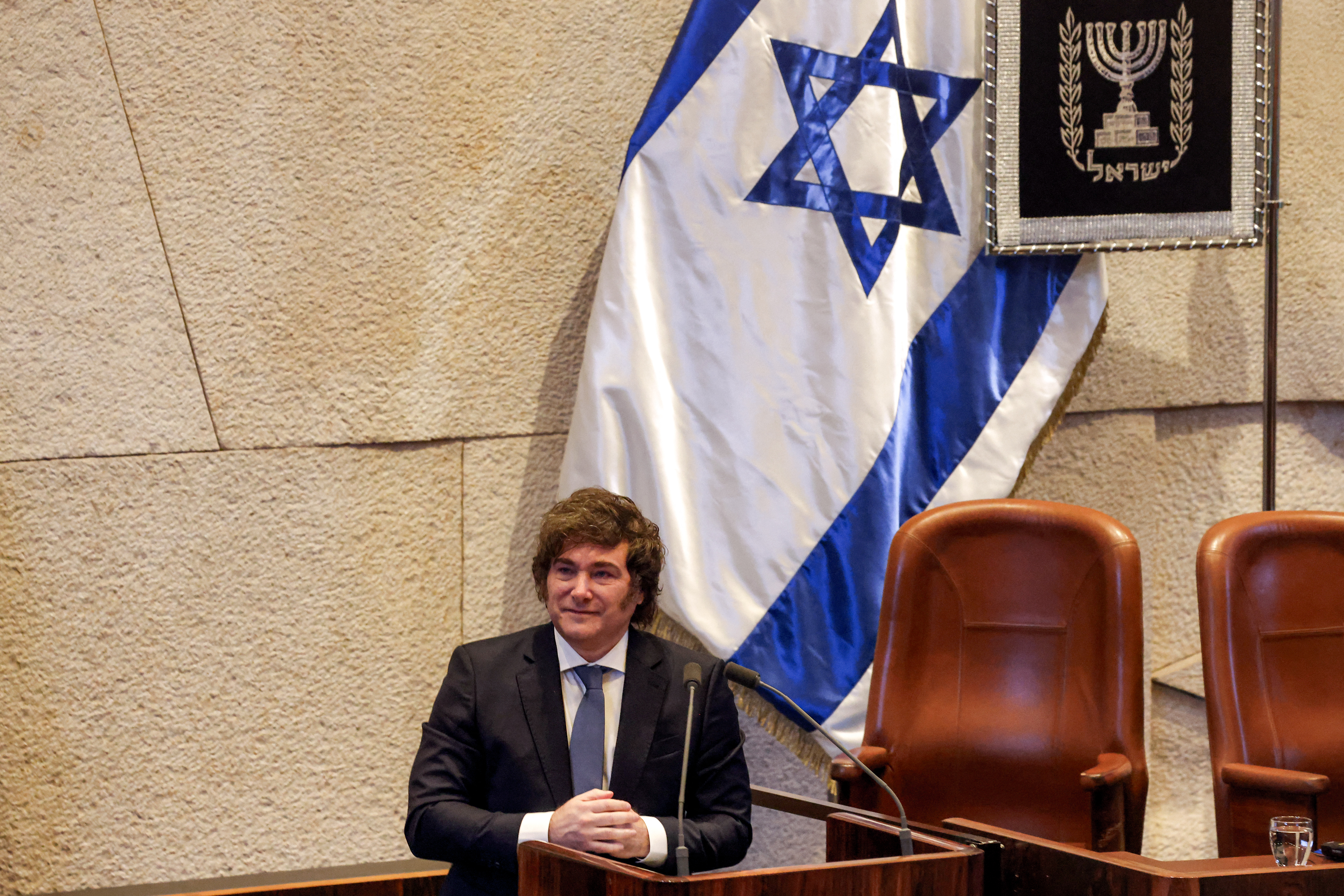 Argentina's President Javier Milei addresses the assembly during a session of the Israeli parliament (Knesset) at its headquarters in Jerusalem on June 11, 2025. (Photo by Menahem KAHANA / AFP)