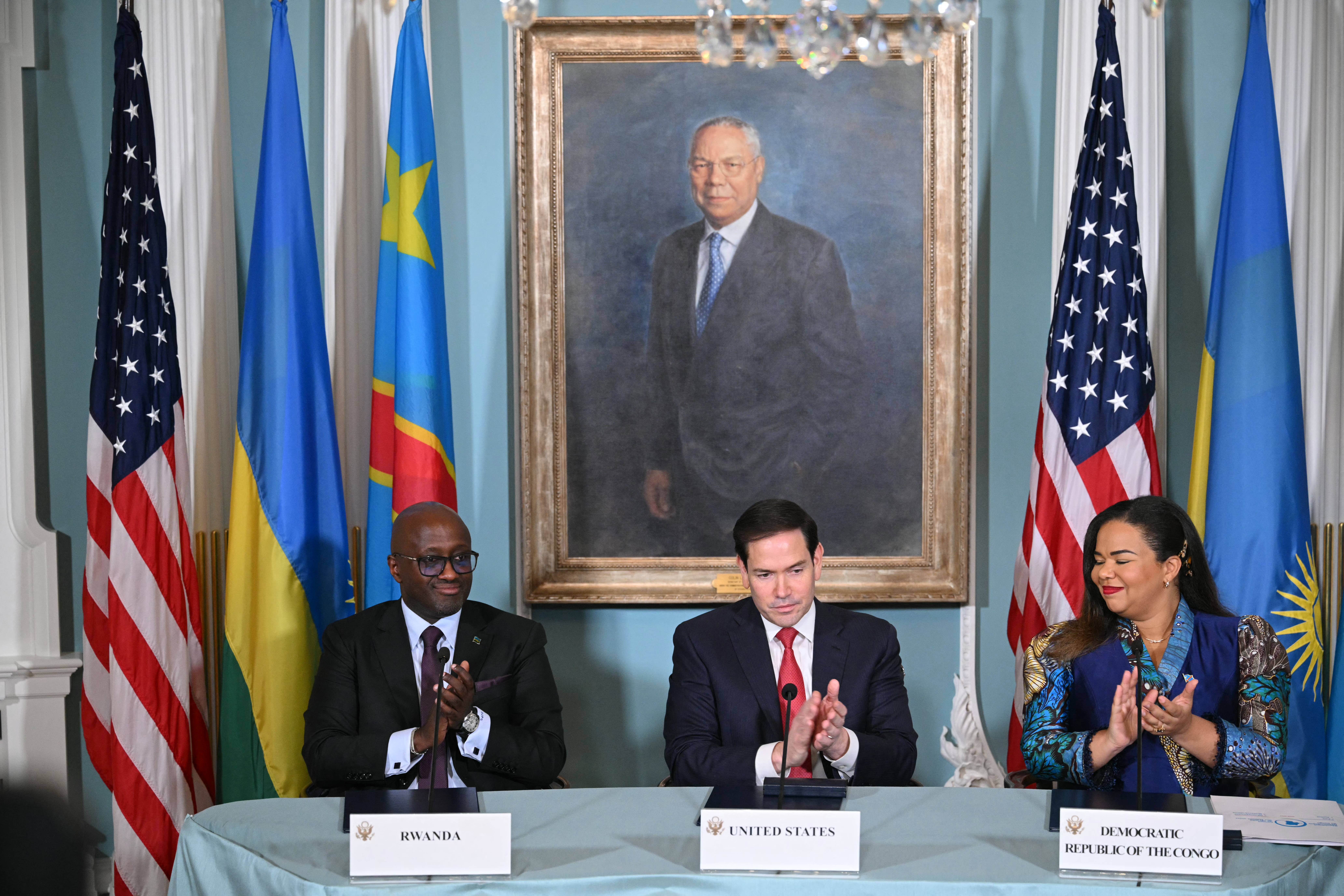 From left, US Secretary of State Marco Rubio, Democratic Republic of the Congo Foreign Minister Thérèse Kayikwamba Wagner, and Rwandan Foreign Minister Olivier Nduhungirehe applaud after signing a peace agreement.