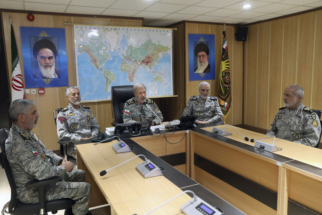 Iran&#039;s army commander-in-chief General Amir Hatami, centre, accompanied by high-ranking army commanders, speaks in a video call with top commanders of the army, in Zolfaghar central headquarters, Iran, June 23, 2025 [Handout: Iranian Army Press Service via AP Photo]