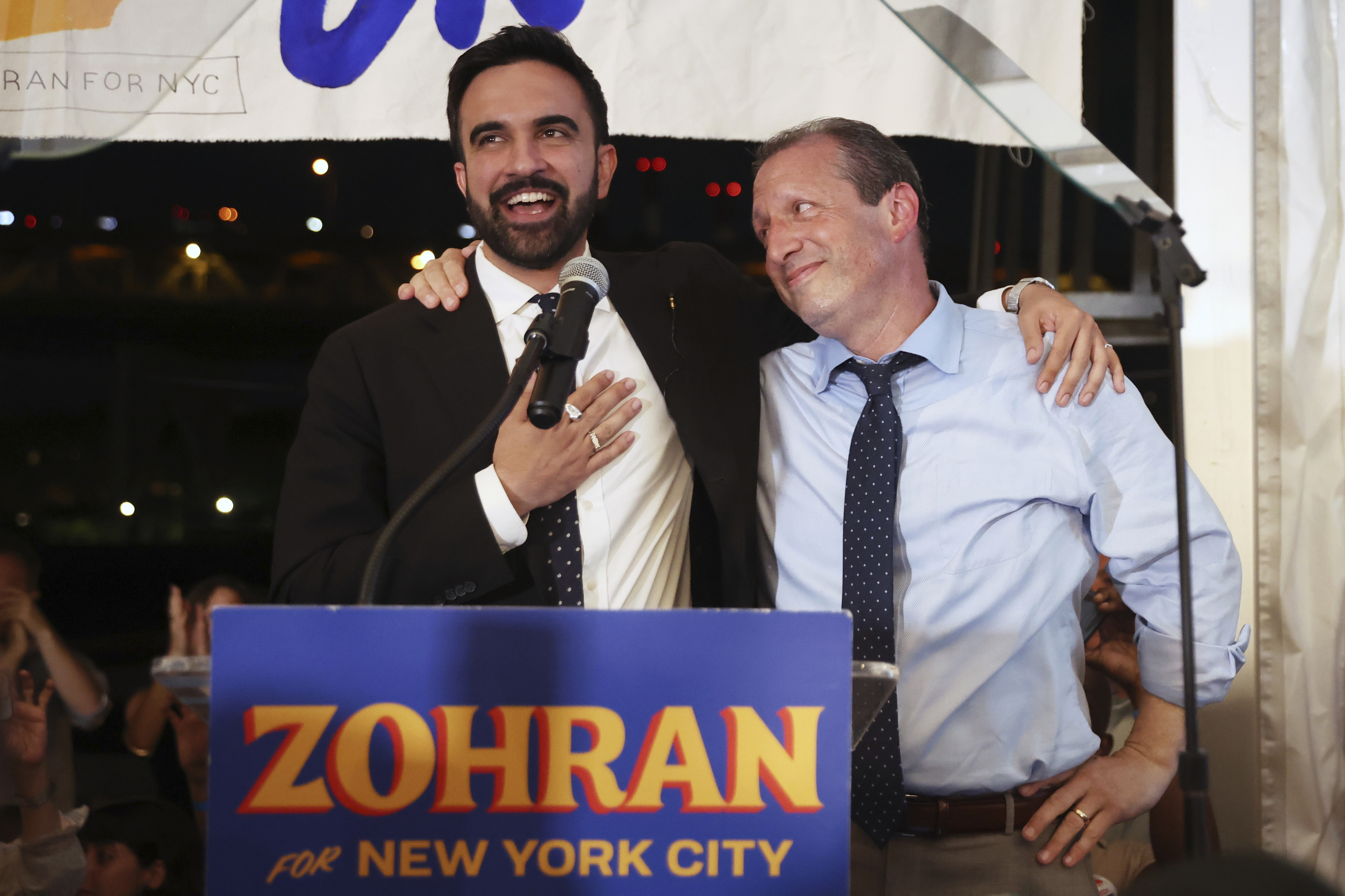 Democratic mayoral candidate Zohran Mamdani, left, speaks on stage with fellow candidate Comptroller Brad Lander at his primary election party,