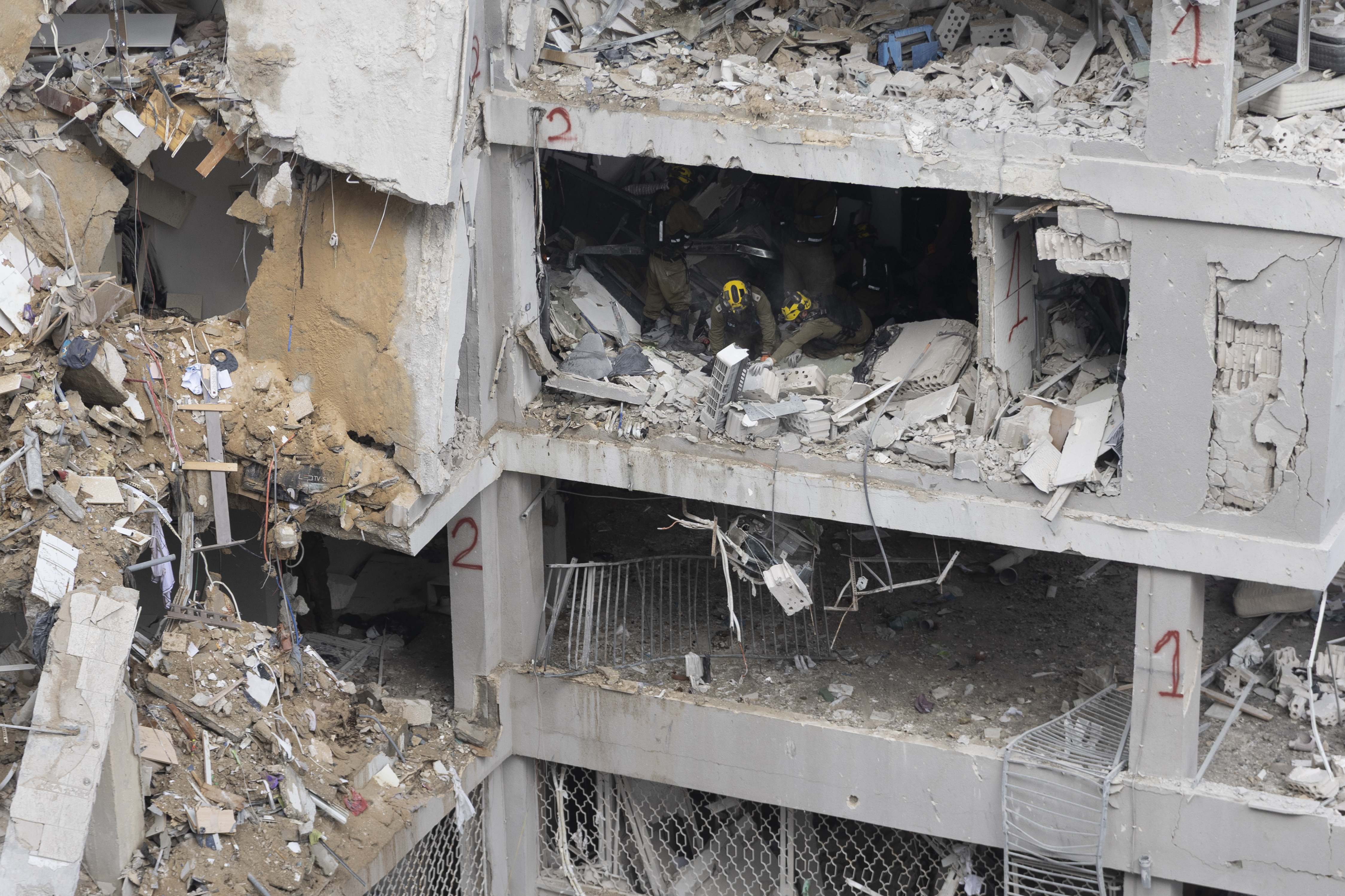 Emergency and rescue workers search for trapped people inside heavily damaged buildings after an overnight missile strike from Iran on June 15, 2025 in Bat Yam, Israel [Amir Levy/Getty Images]