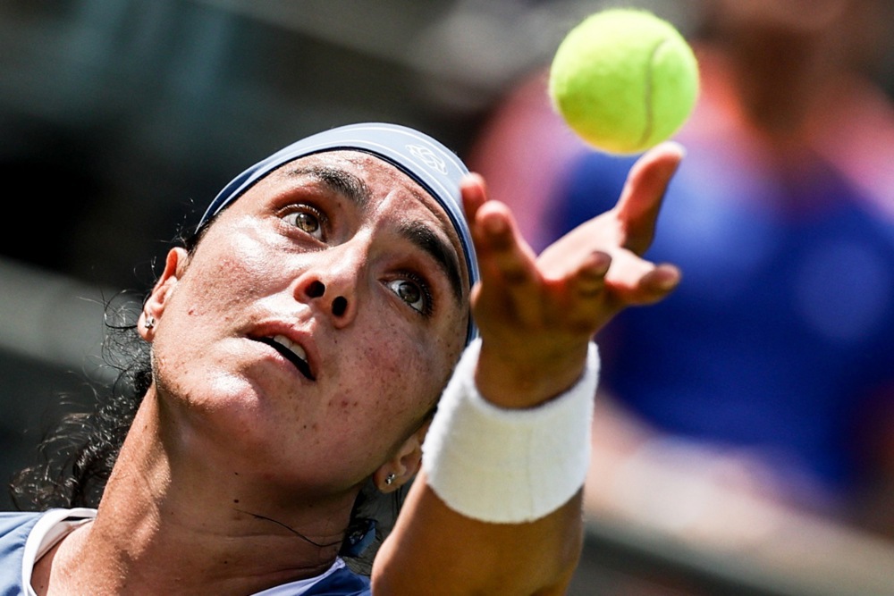 Ons Jabeur of Tunisia in action during her Round of 16 match against Jasmine Paolini of Italy at the WTA German Open tennis