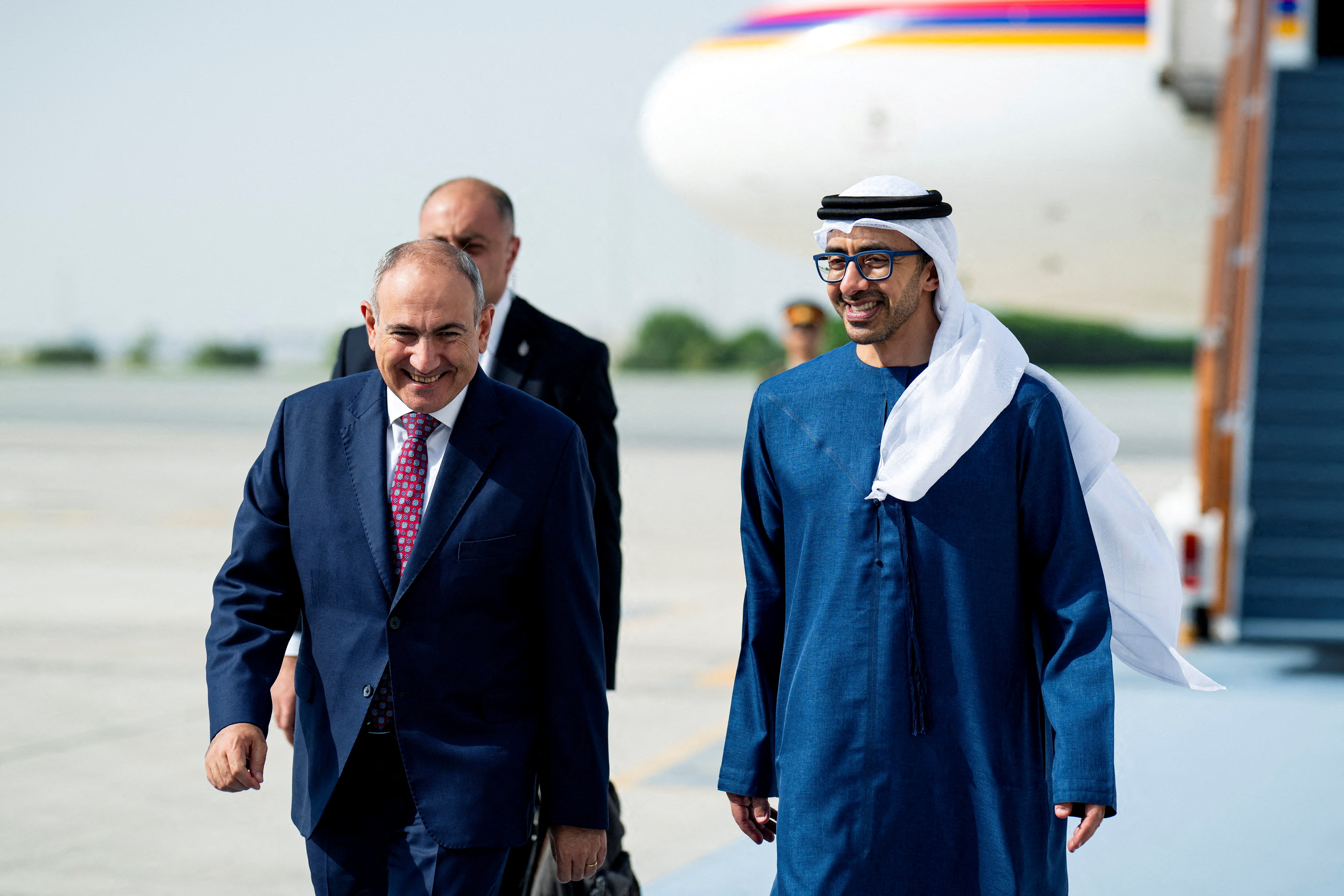 United Arab Emirates' Deputy Prime Minister and Minister of Foreign Affairs Sheikh Abdullah bin Zayed Al Nahyan receives Armenian Prime Minister Nikol Pashinyan at an airport.