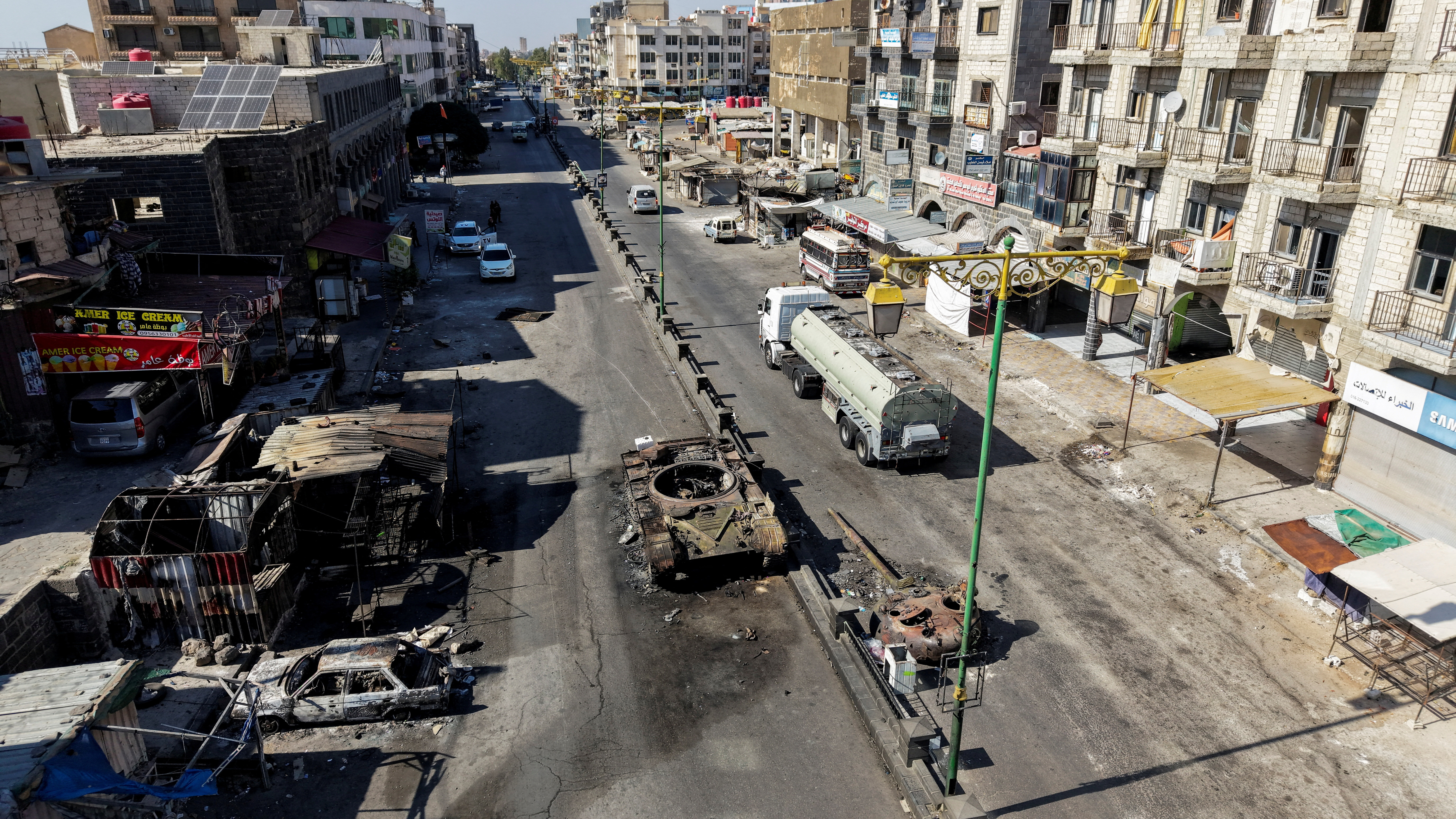 A drone view shows the remains of a destroyed tank, following deadly clashes between Druze fighters, Sunni Bedouin tribes and government forces, in Syria's predominantly Druze city of Sweida