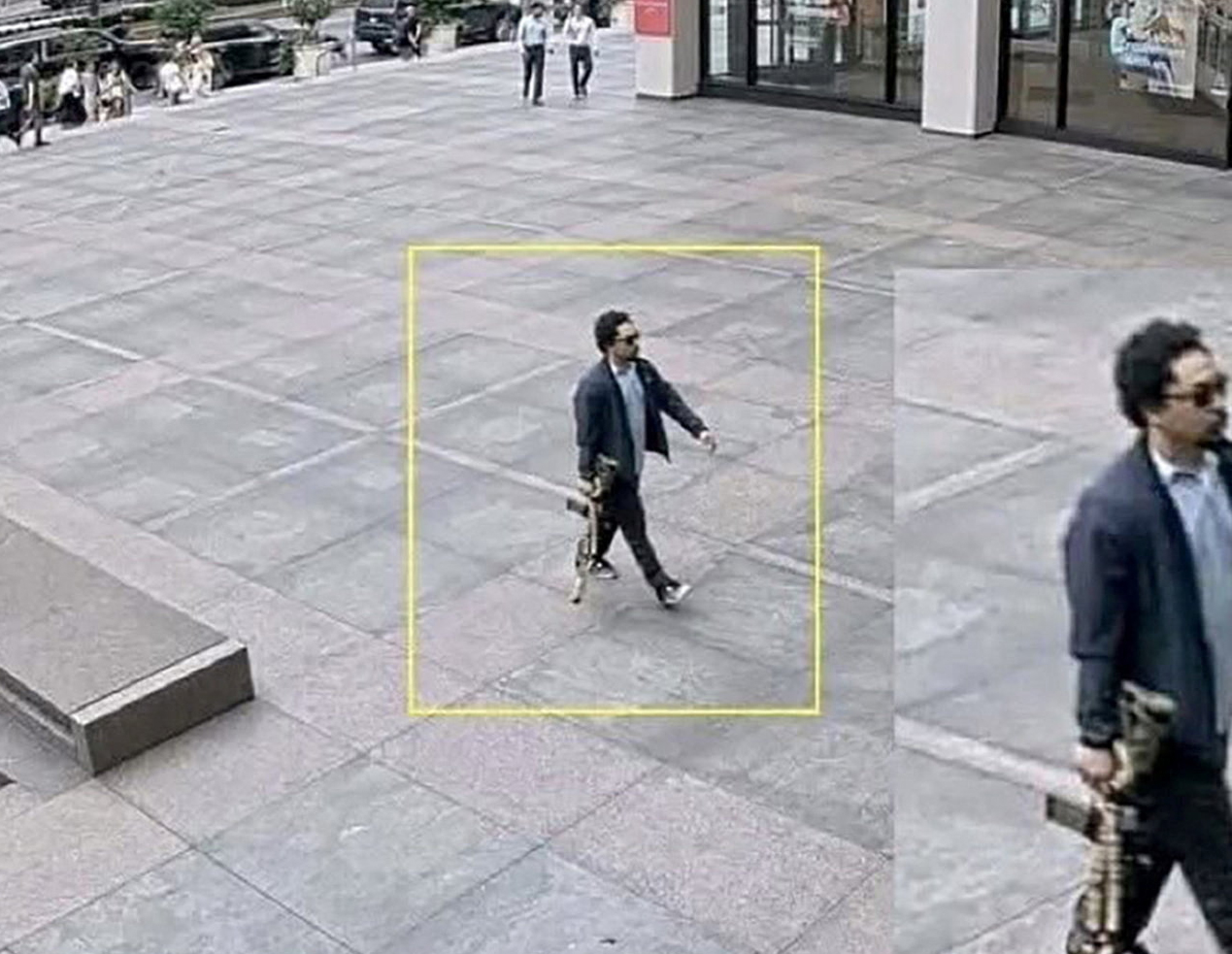 A man holding a rifle walks into an office building at 345 Park Avenue shortly before a shooting that killed several people, in the Midtown Manhattan district of New York City, U.S. July 28, 2025, in a still image taken from surveillance video. [Handout via Reuters] (Reuters)