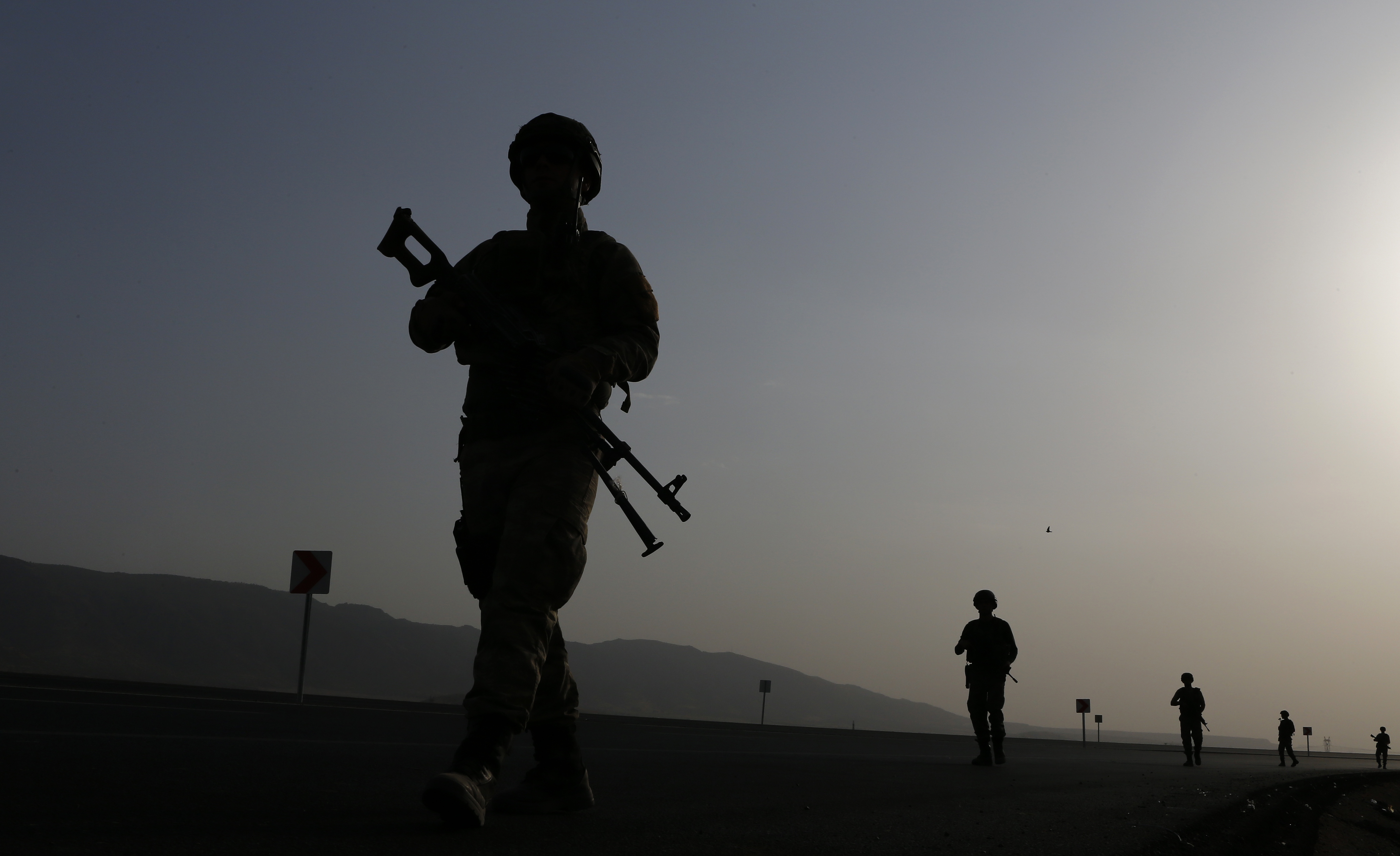 Turkish soldiers patrol the road near the Turkish-Iraq border in Silopi district in Sirnak city, Turkiye [File: Sedat Suna/EPA]