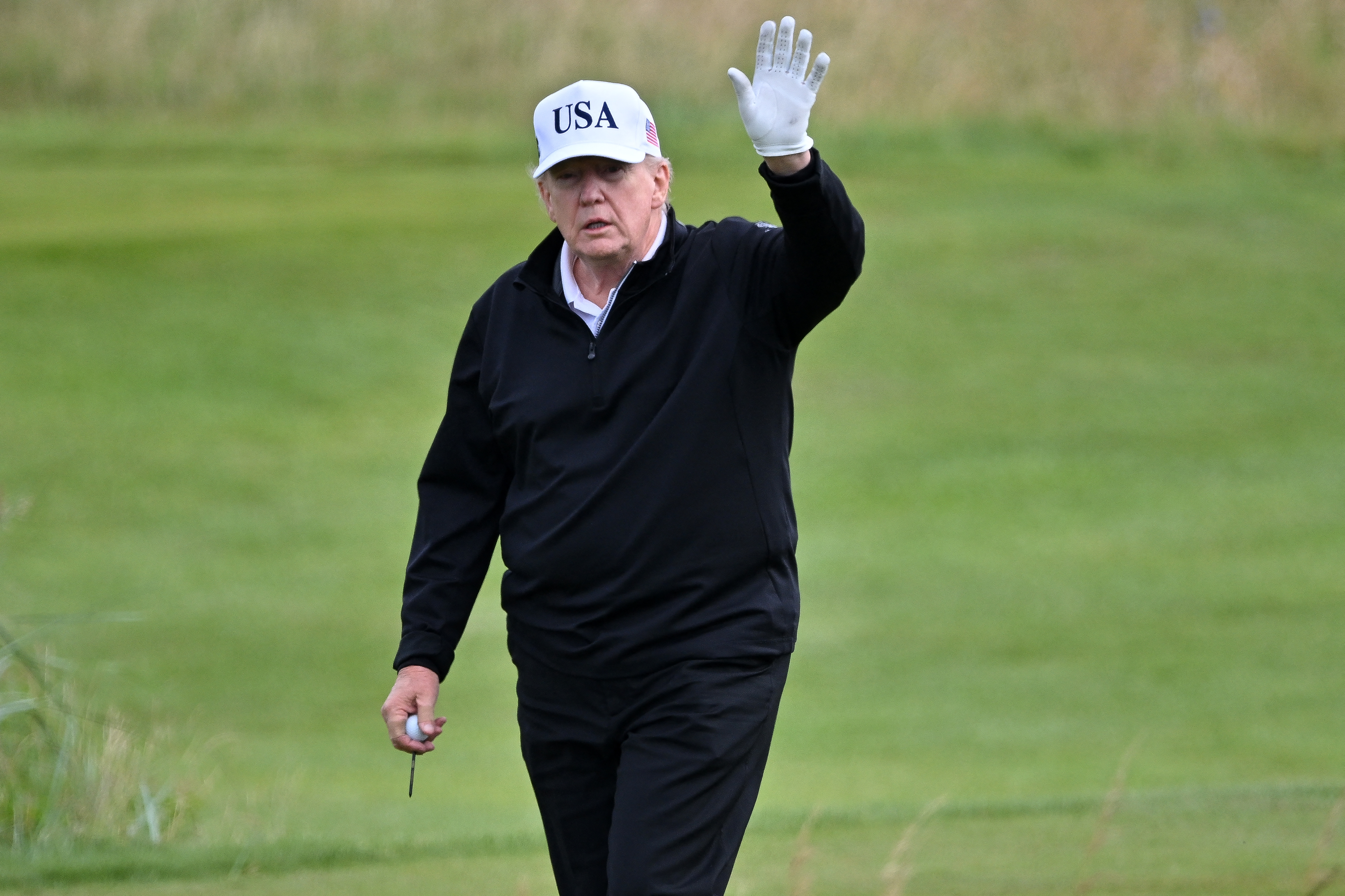 US President Donald Trump reacts as he plays golf at the Trump Turnberry Golf Courses, in Turnberry on the south west coast of Scotland on July 26, 2025.
