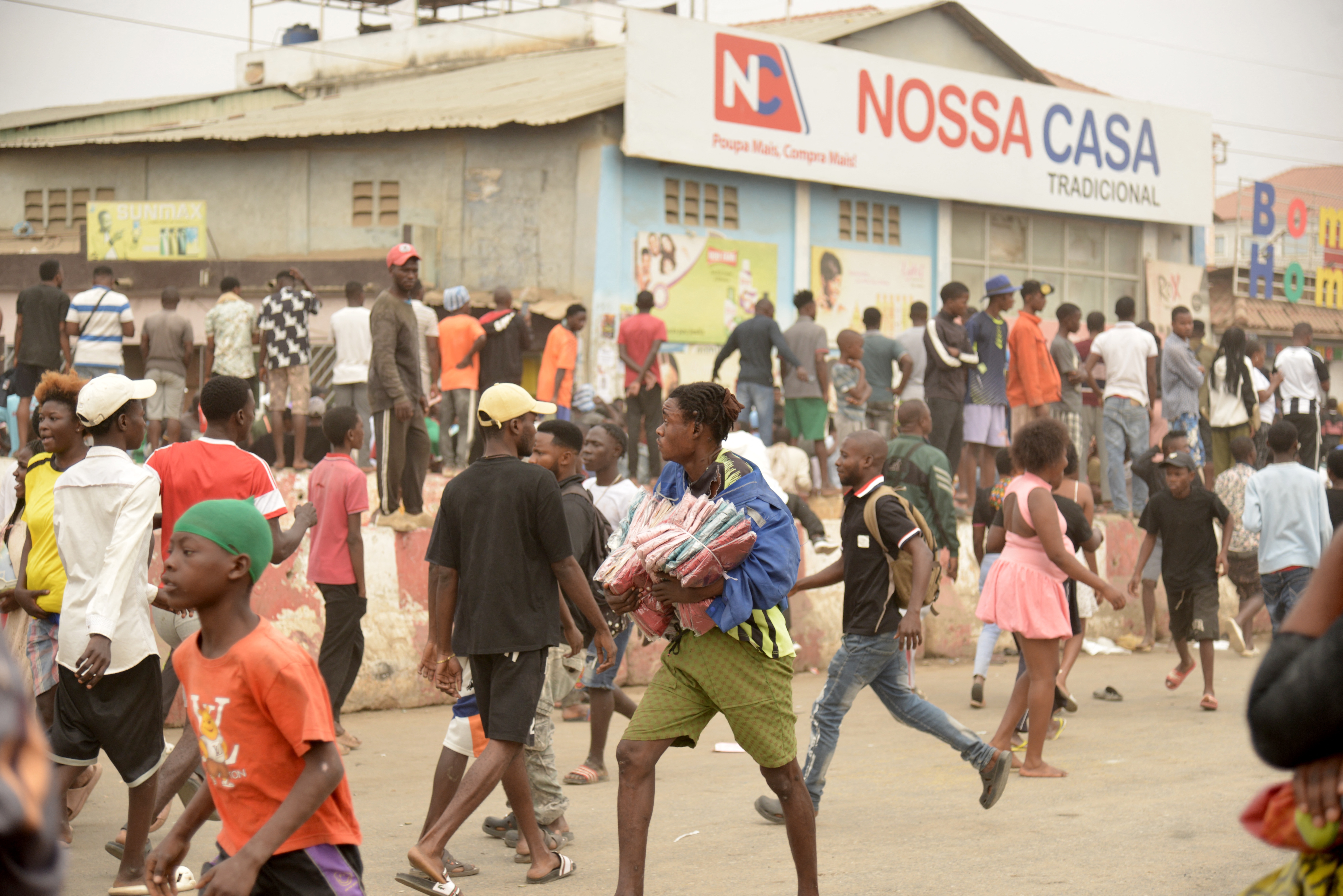 A group of shops are targeted as looting erupted in the Kalemba 2 district of Luanda on July 28, 2025 during a general strike in the taxi sector declared for three days to protest against the rising prices of fuel.