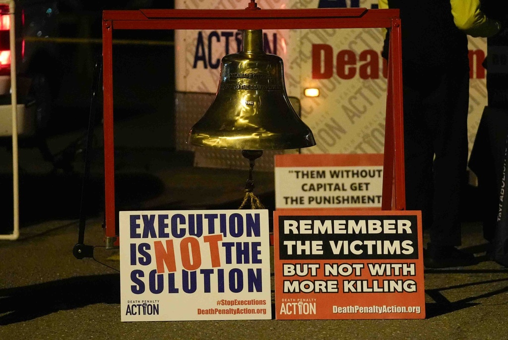 Signs against the death penalty set up by activists outside of Indiana State Prison on Tuesday, December 17, 2024, in Michigan City, Indiana, US