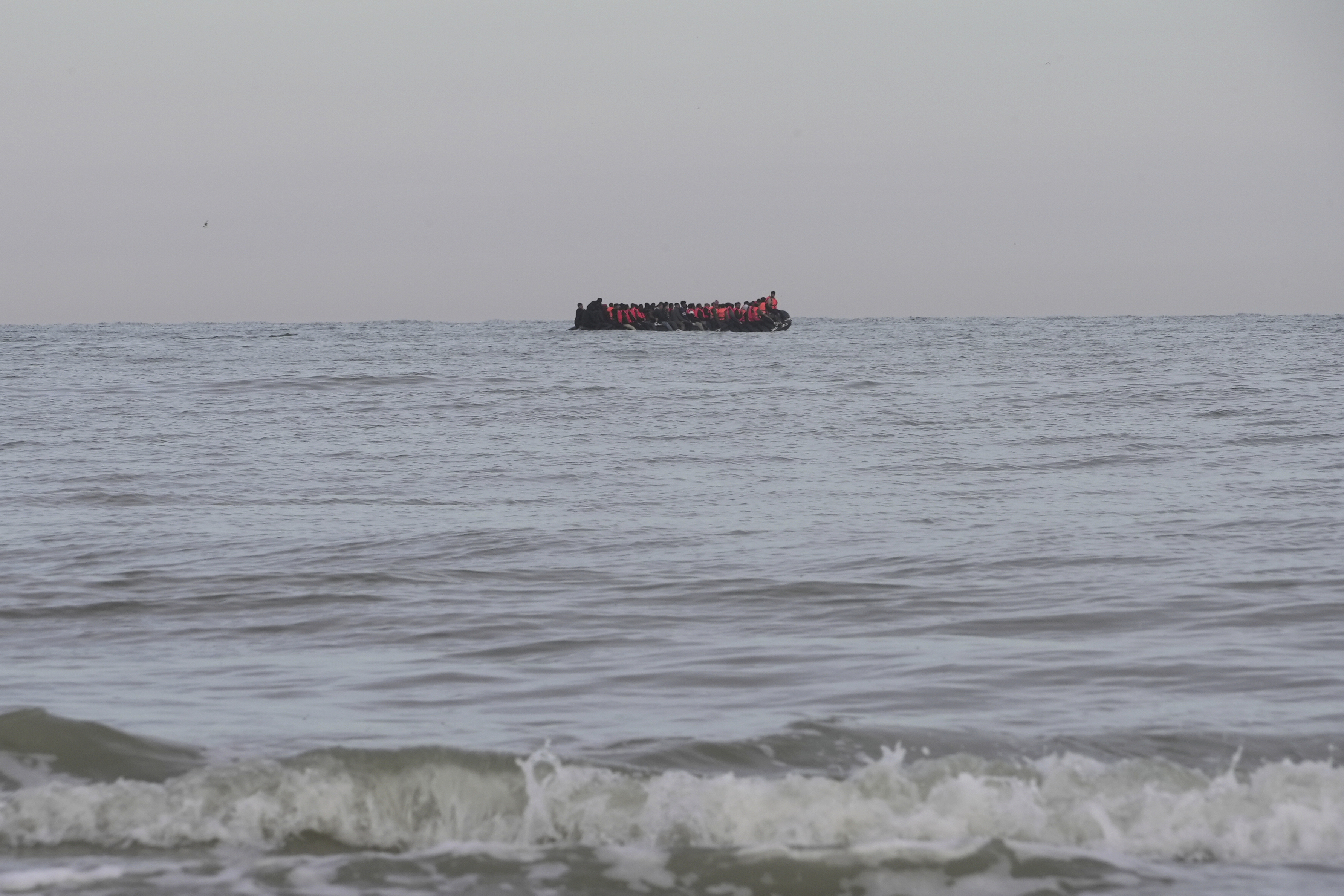 "Taxi boats" motor to pre-arranged off-shore pick-up points, where migrants waiting on the beaches then wade into the water, on July 4, 2024 in Hardelot beach south of Boulogne-sur-Mer, northern France.