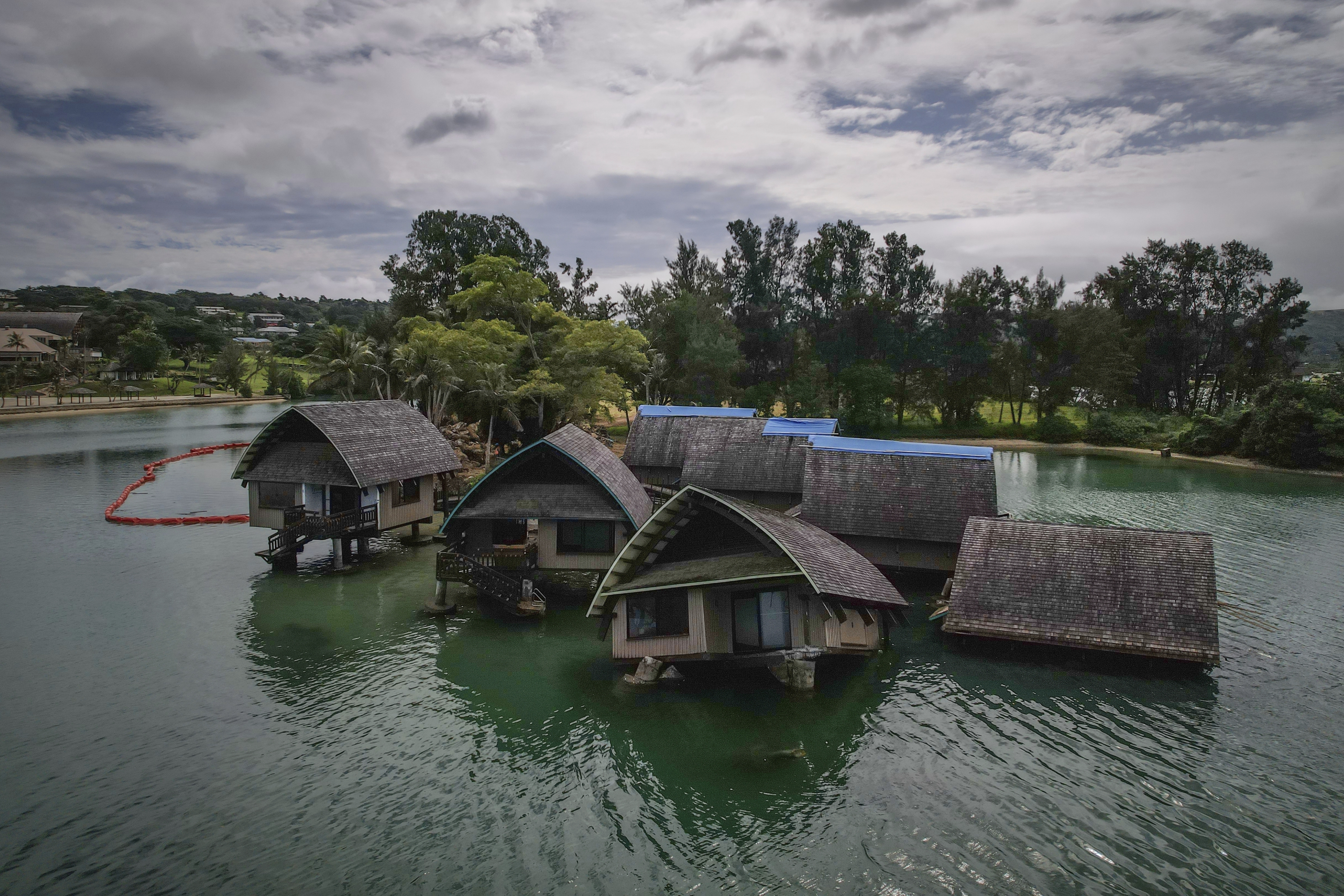 The once iconic Holiday Inn villas in Port Vila, Vanuatu, sit partially sunken.