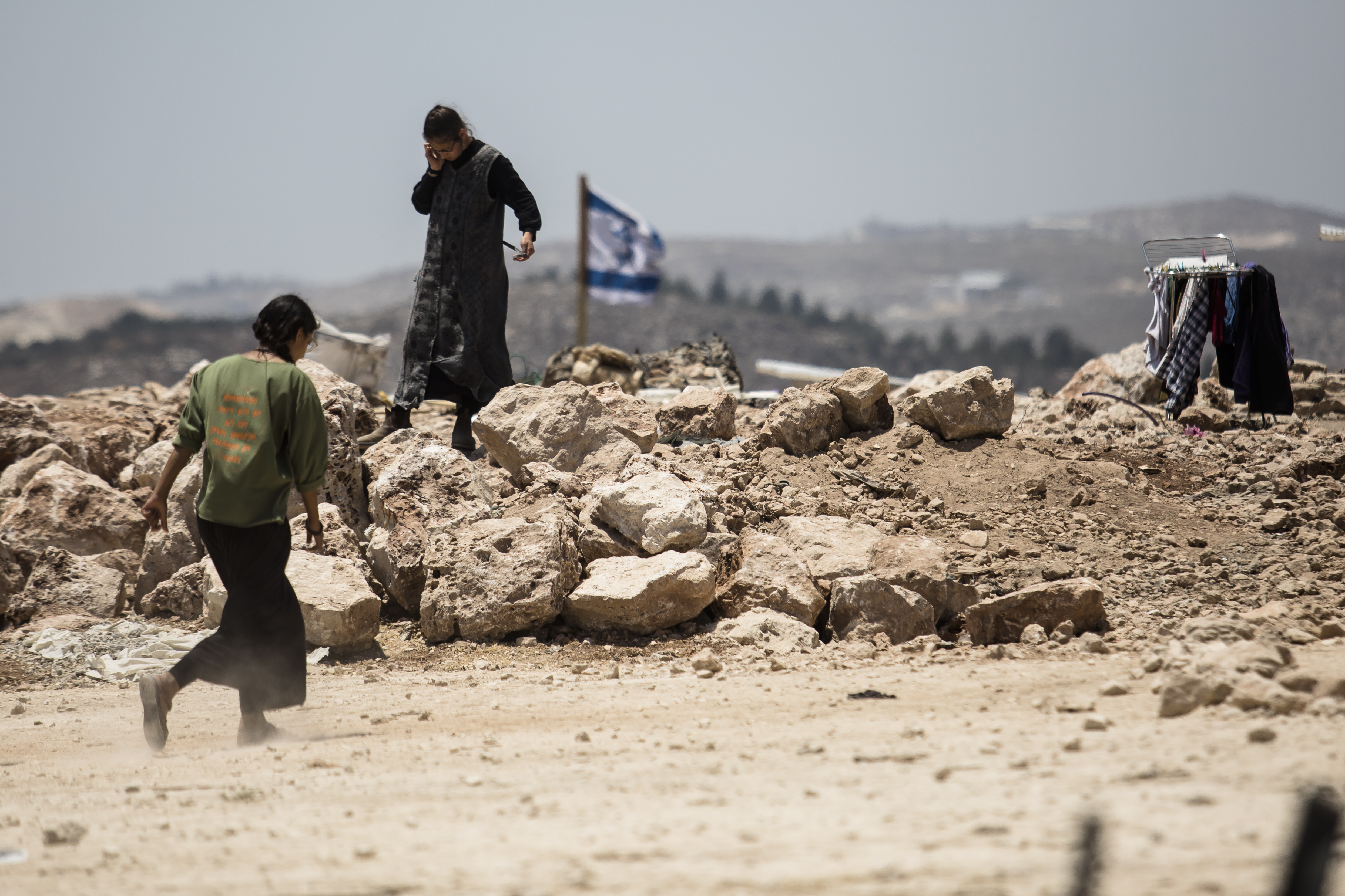 Jewish Israeli settler walks at a recently established outpost.