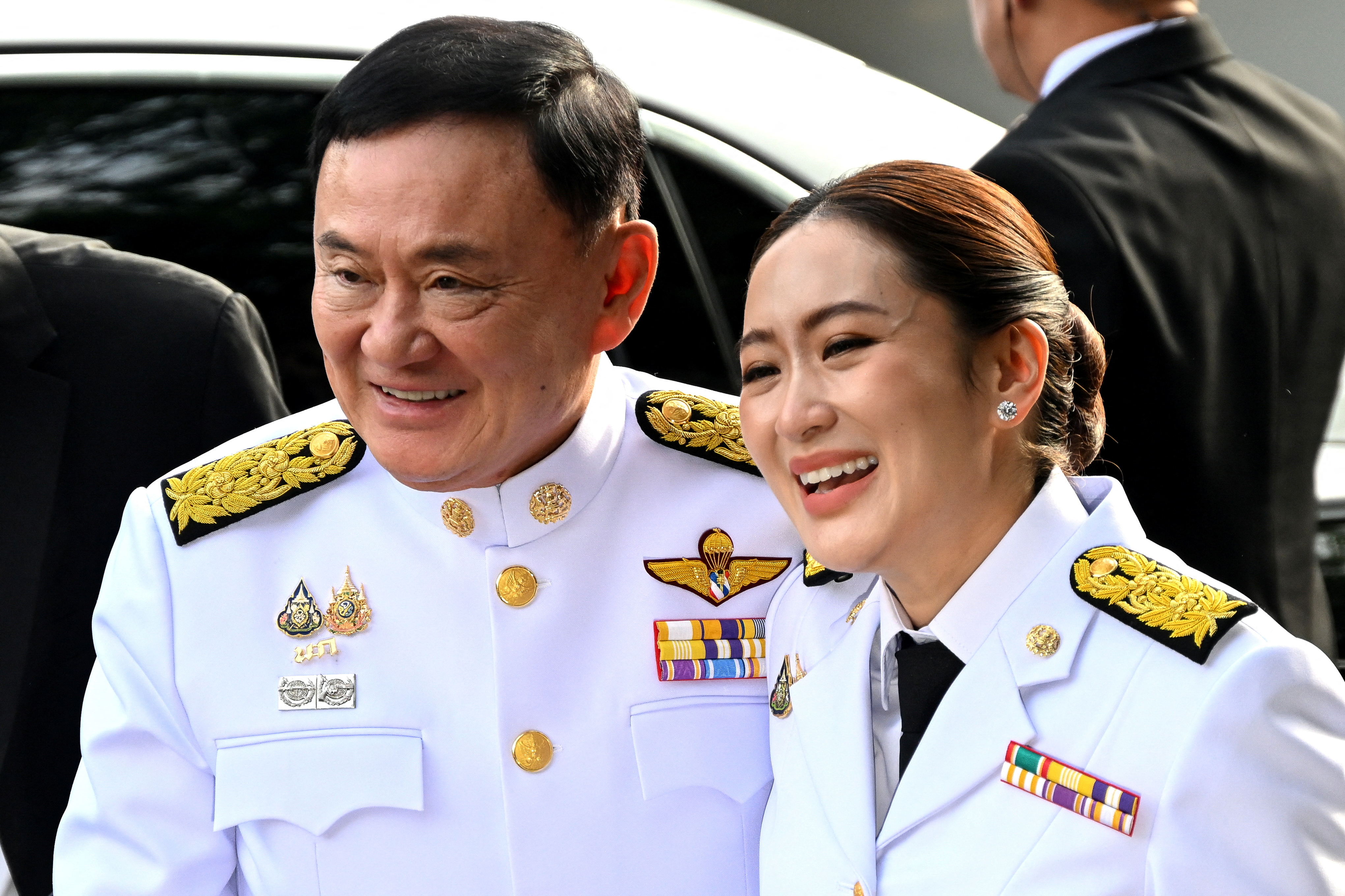 Thailand Prime Minister-elect Paetongtarn Shinawatra arrives with her father former Prime Minister Thaksin Shinawatra at the Pheu Thai party headquarters ahead of a royal endorsement ceremony in Bangkok, Thailand, August 18, 2024.