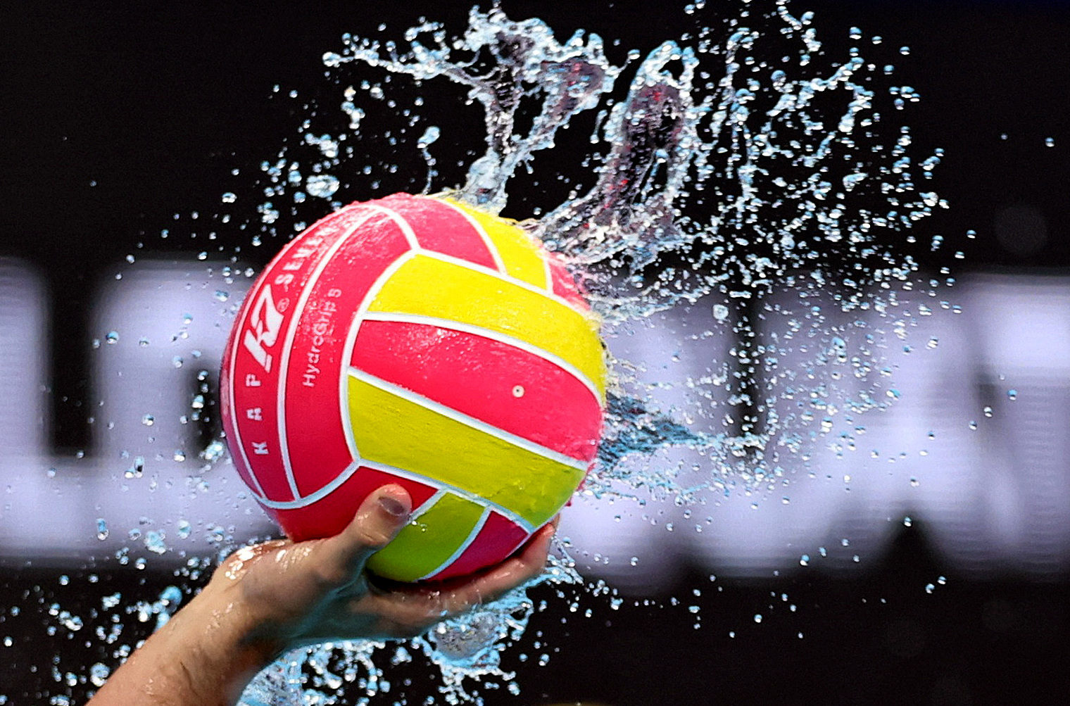 General view as water splashes off the match ball in a water polo match
