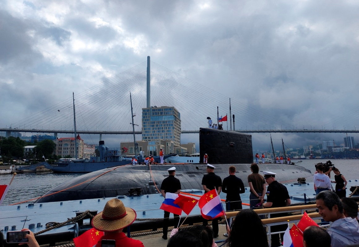 People take part in a ceremony marking the start of the upcoming Russian-Chinese joint naval drills in the Sea of Japan, following the arrival of Chinese military vessels in Vladivostok, Russia, July 31, 2025. Russian Defence Ministry/Russia's Pacific Fleet/Handout via REUTERS ATTENTION EDITORS - THIS IMAGE HAS BEEN SUPPLIED BY A THIRD PARTY. NO RESALES. NO ARCHIVES. MANDATORY CREDIT.