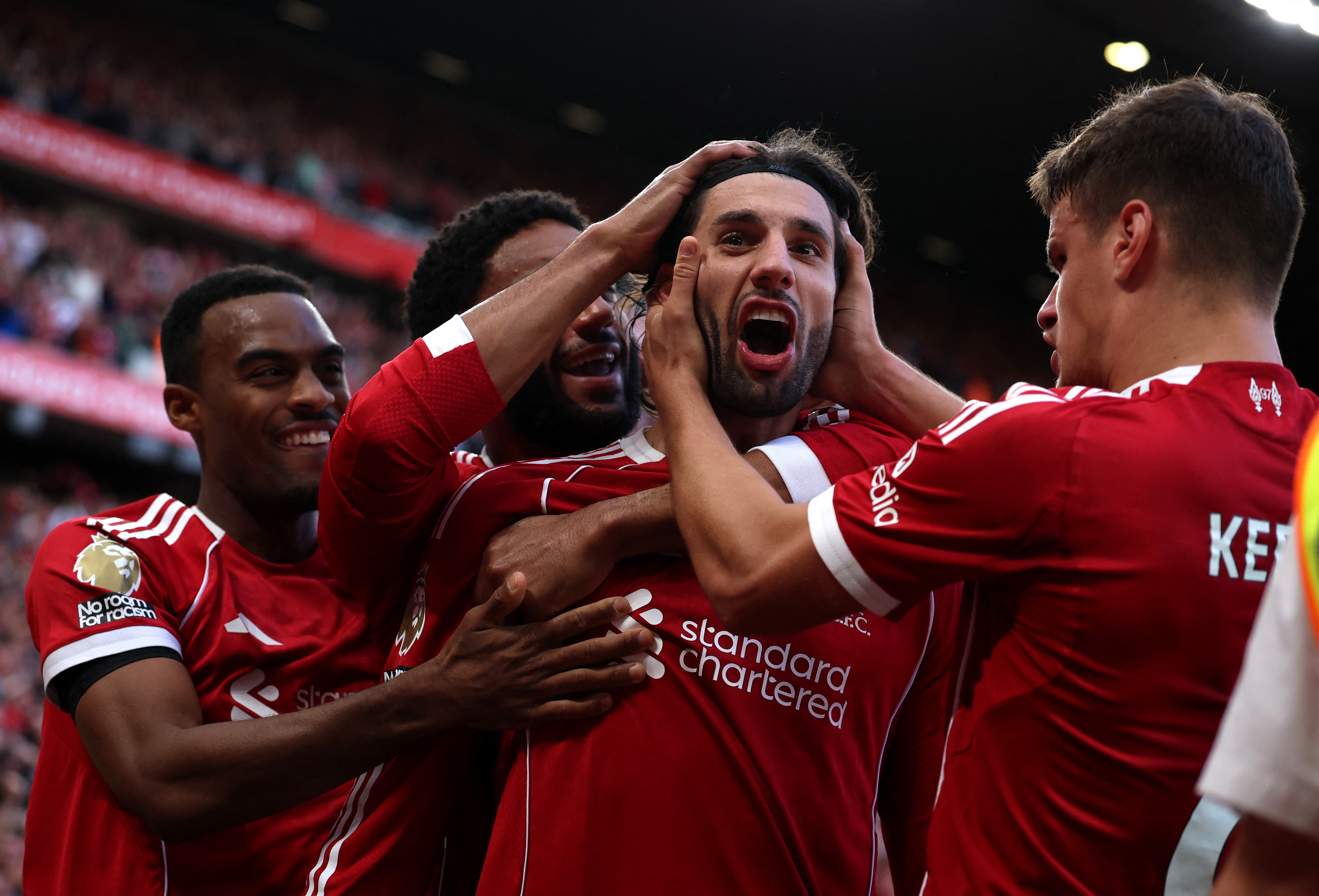 Liverpool's Dominik Szoboszlai celebrates scoring their first goal with Milos Kerkez, Joe Gomez and Ryan Gravenberch
