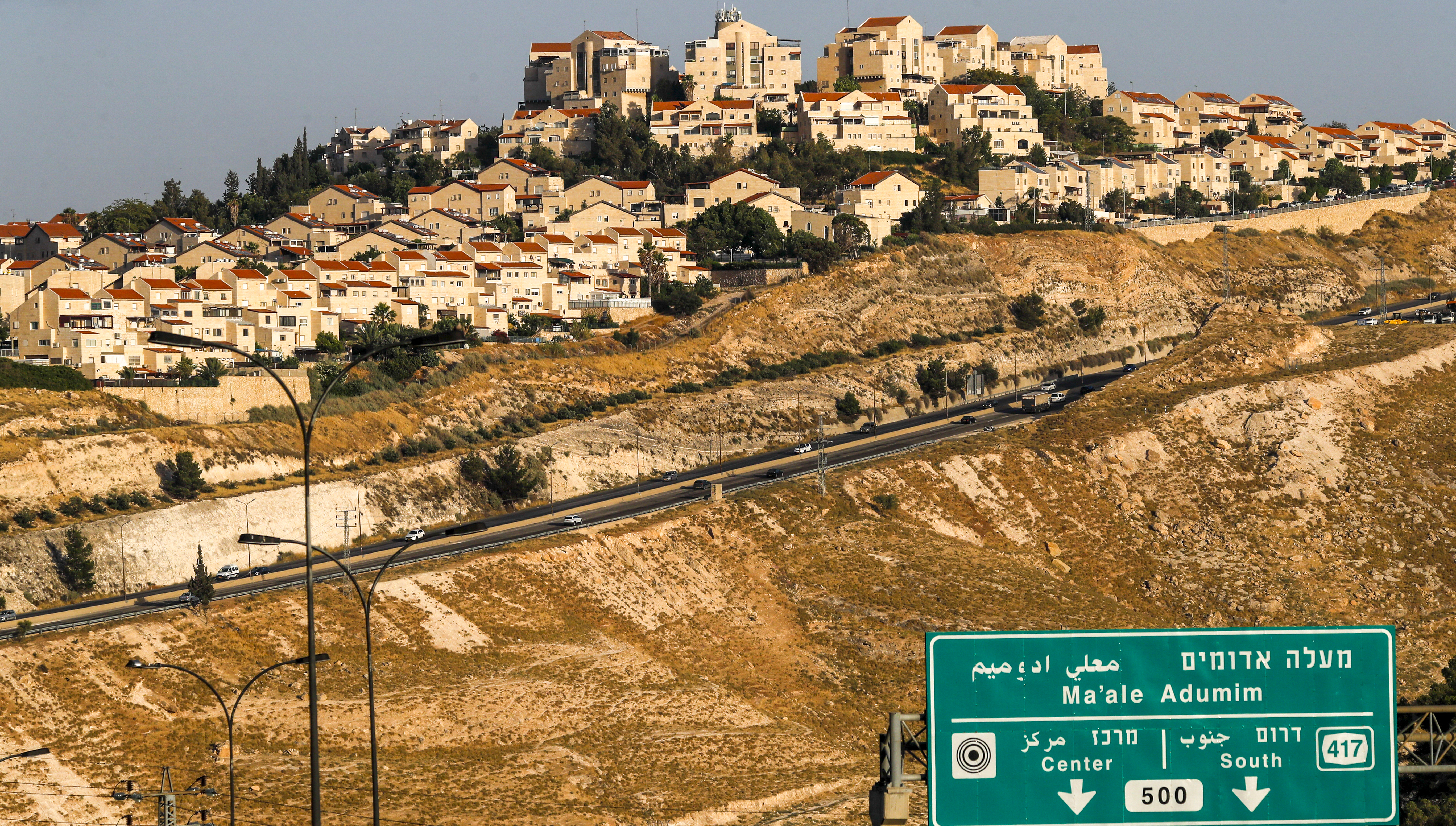 A picture taken from the E1 corridor of the occupied West Bank shows Israeli settlement of Maale Adumim in the background