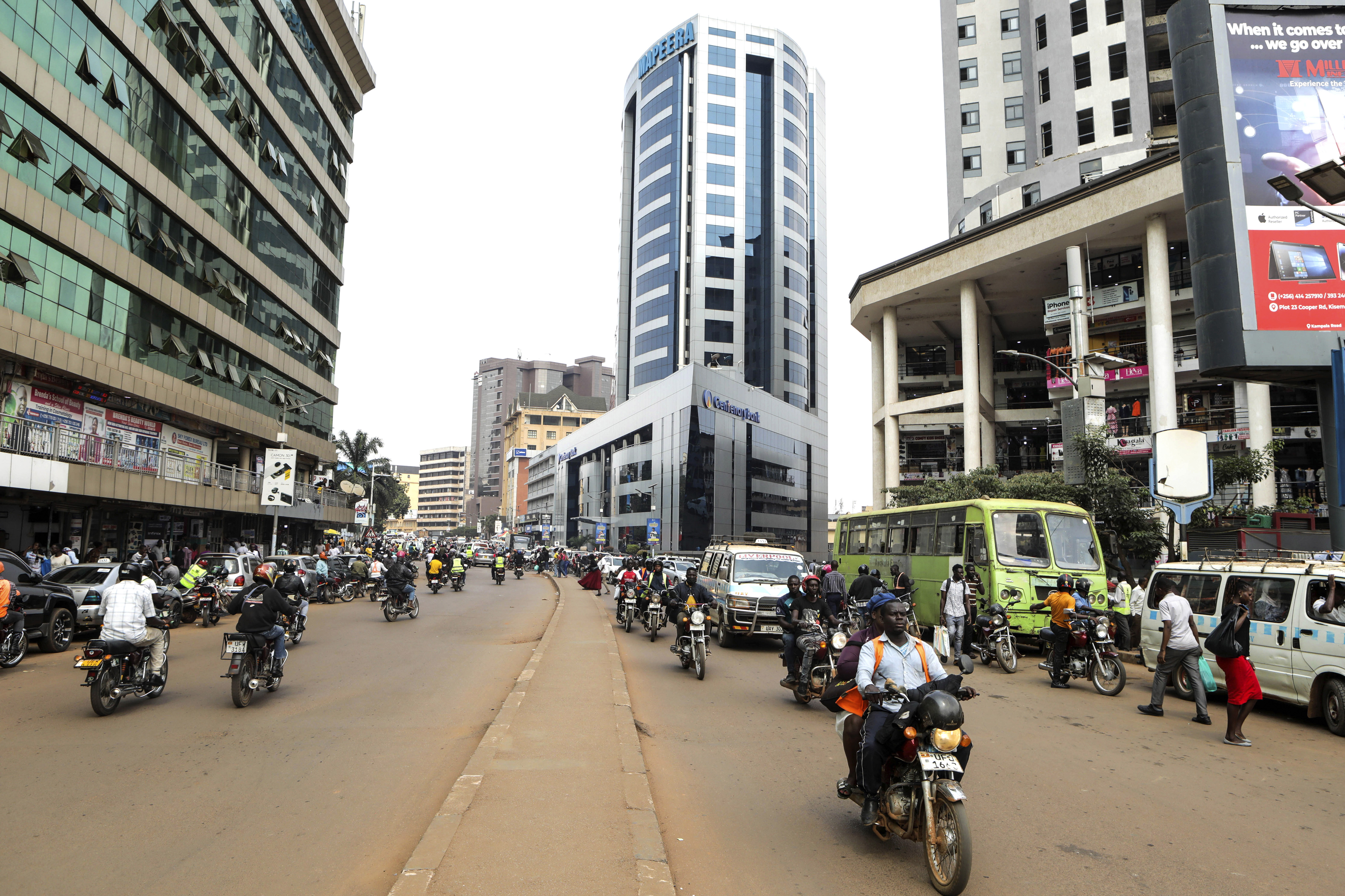 Boda bodas ride on a street in Kampala
