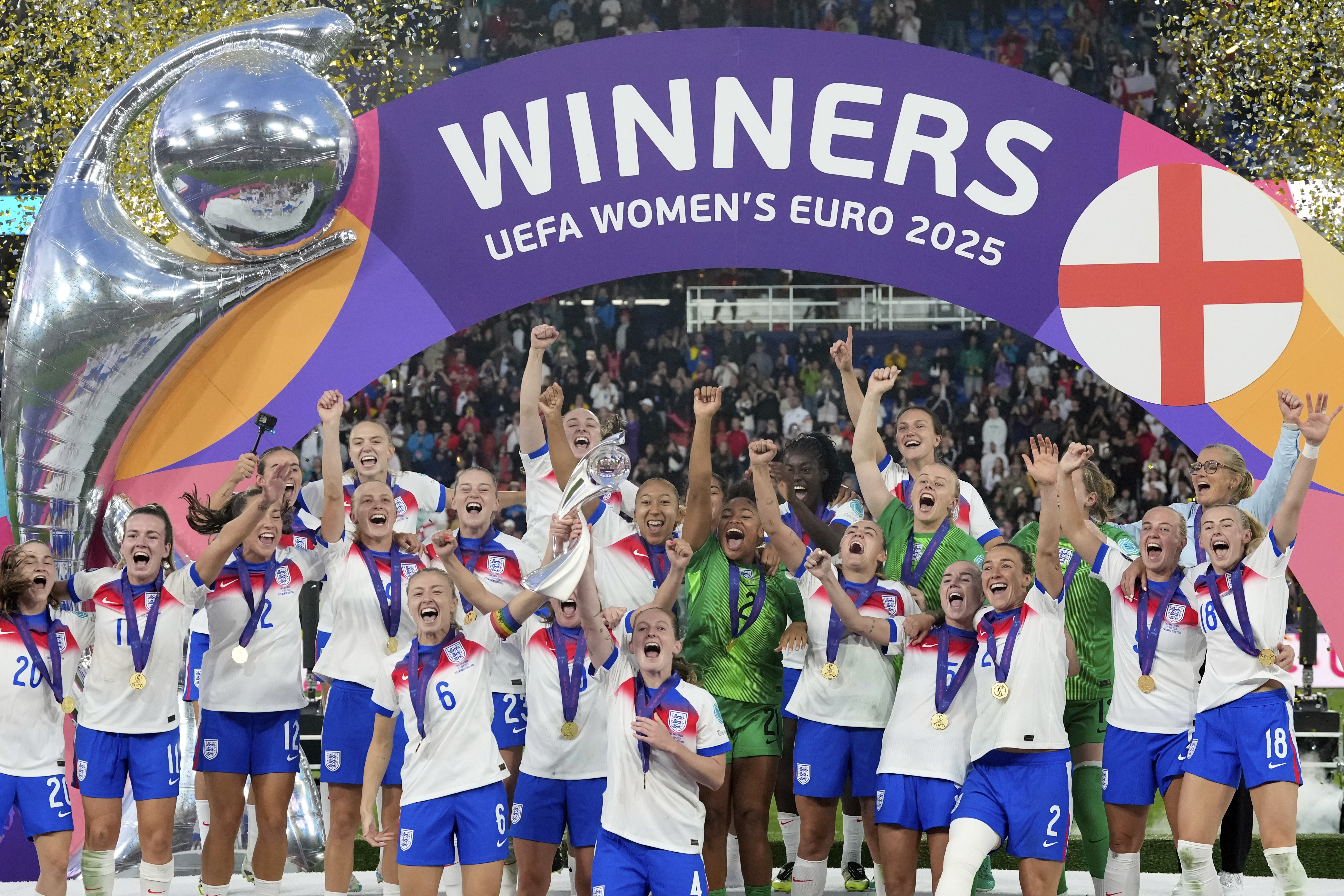 England's Leah Williamson, center left, and Keira Walsh lift the trophy after winning the Women's Euro 2025 final soccer match between England and Spain at St. Jakob-Park in Basel, Switzerland