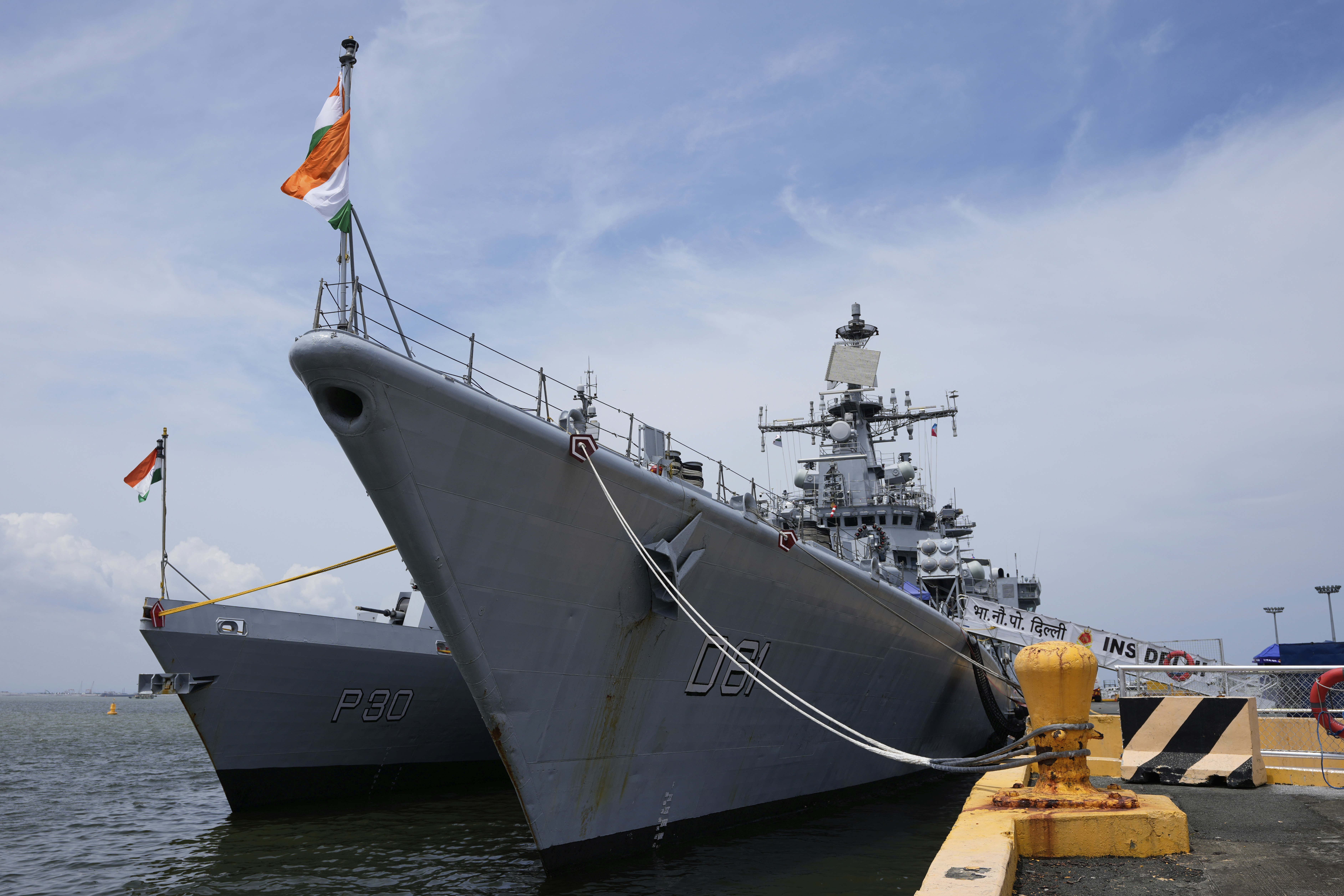 Indian navy ships dock at port.
