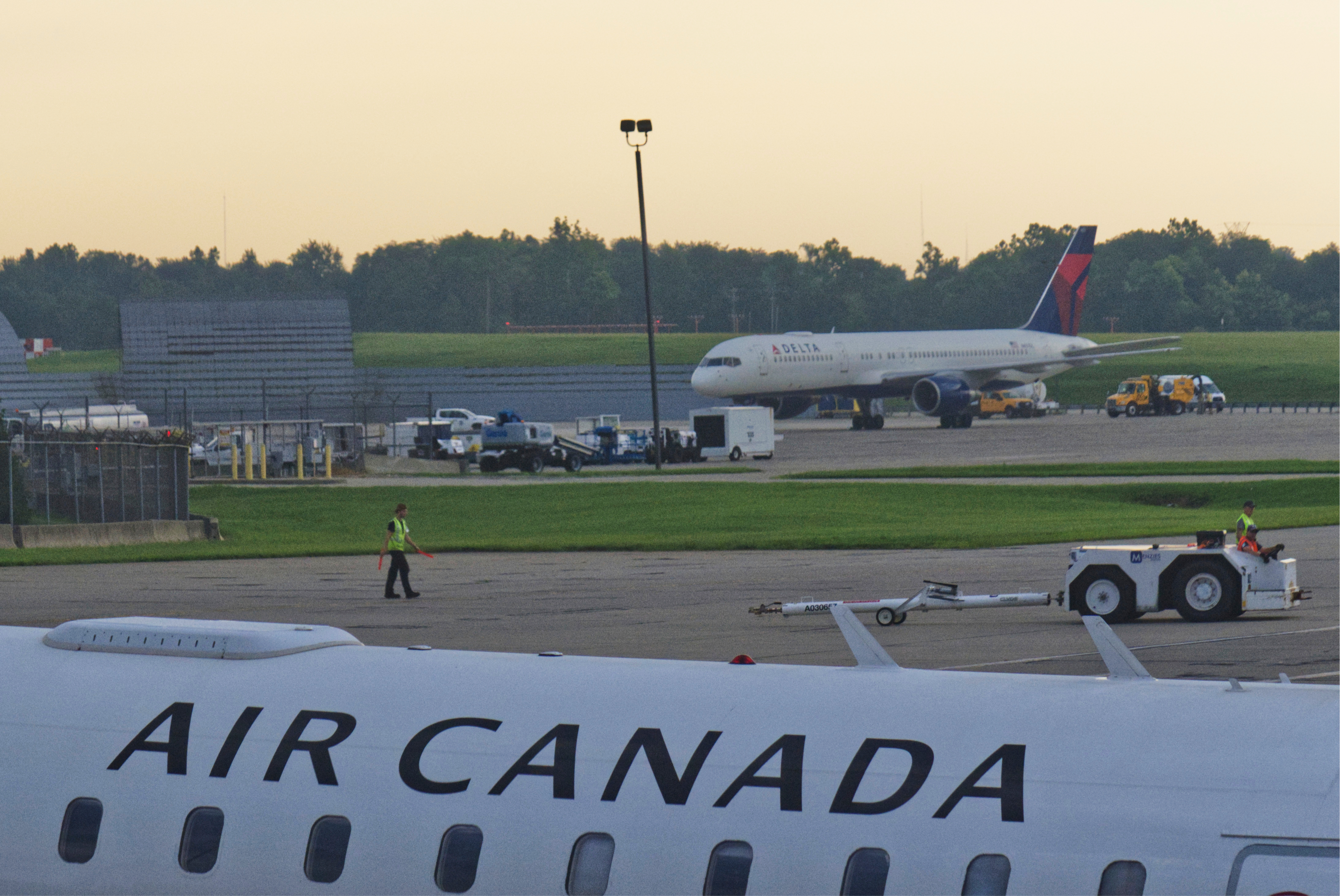 An Air Canada Express Bombardier CRJ900 operated by Jazz Aviation LP sits on the tarmac at Cincinnati/Northern Kentucky International Airport outside of Hebron, Ky., Friday, Aug. 15, 2025. (AP Photo/Jon Gambrell)