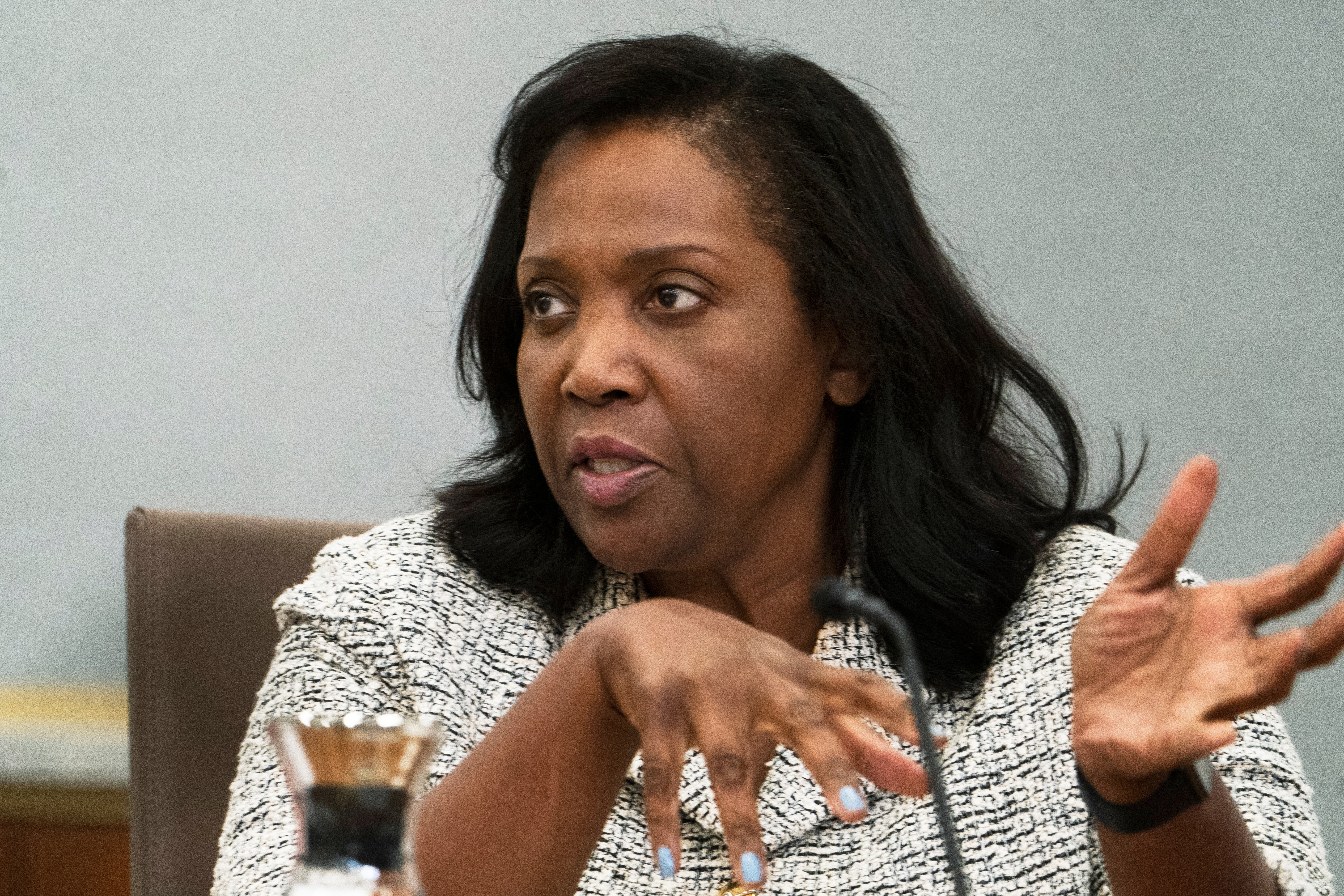 Lisa Cook gestures as she speaks.