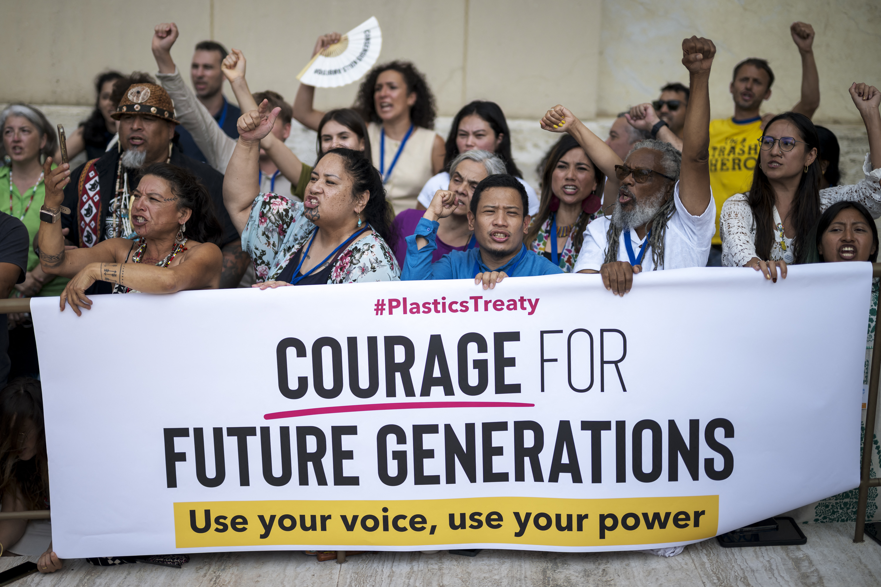 Activits stage a protest during the final days the Plastics Treaty Negotiations at the United Nations Offices in Geneva on August 13, 2025.