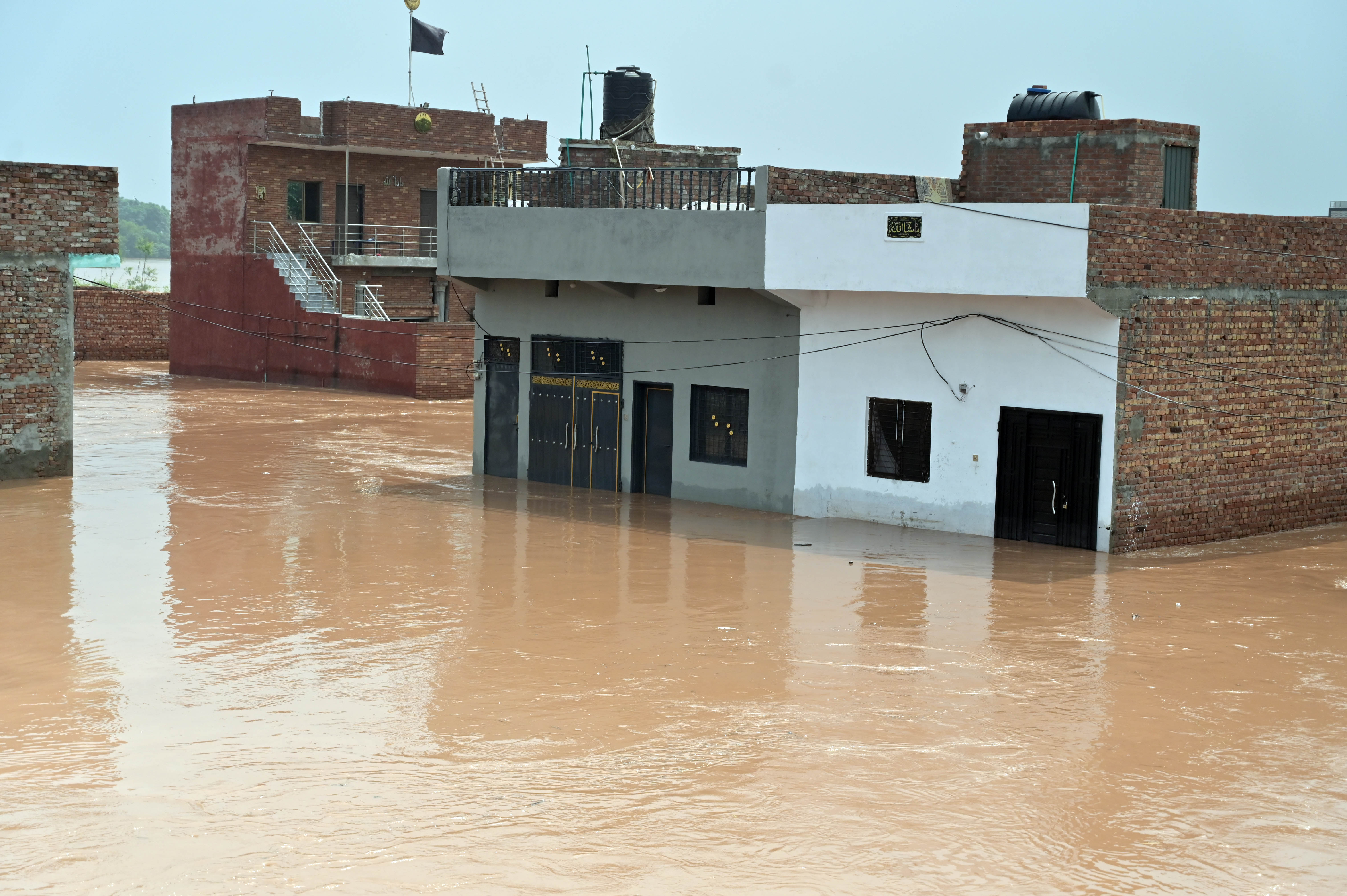 A view of houses submerged in floodwaters.