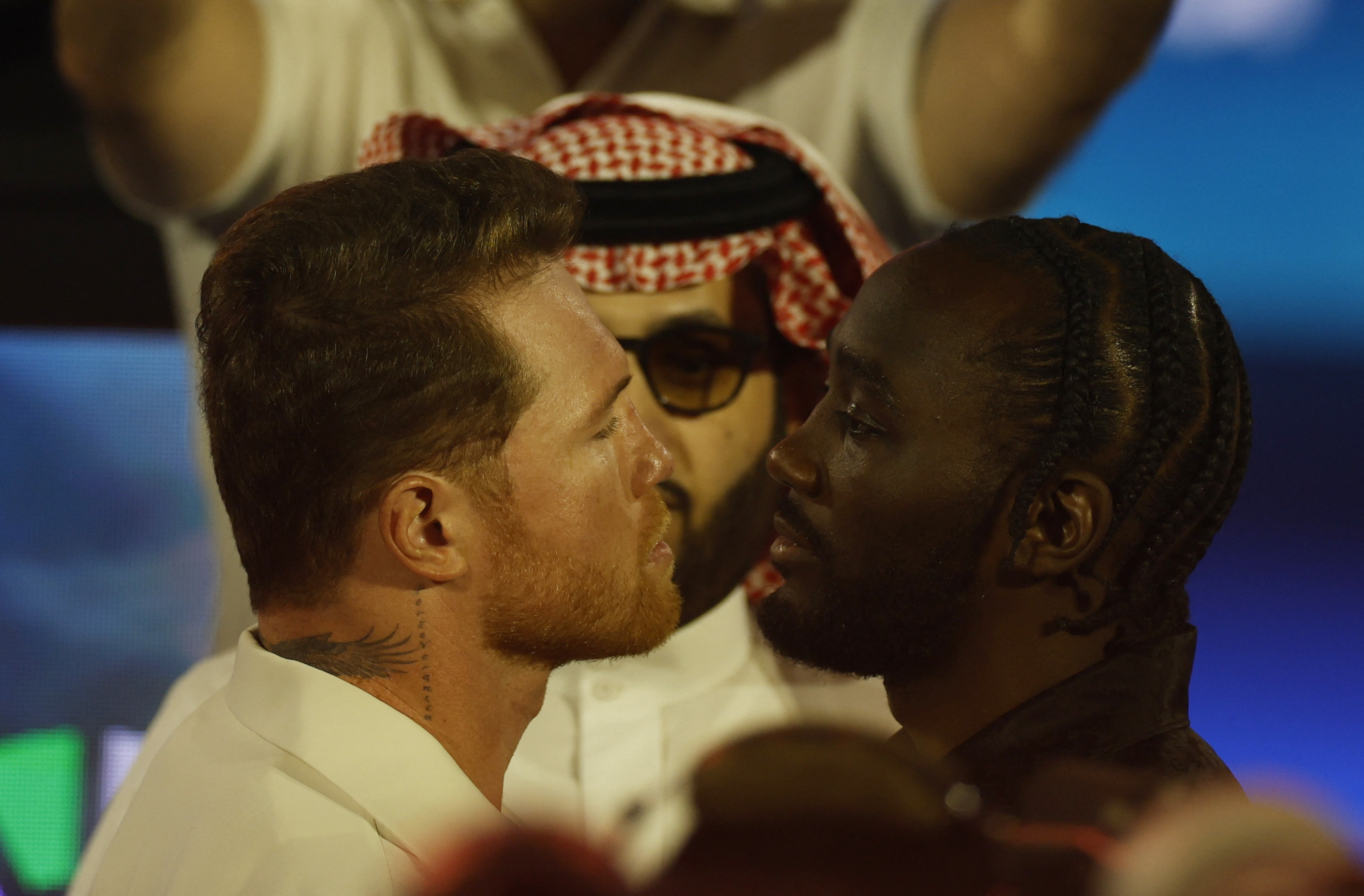 Canelo Alvarez and Terence Crawford react.