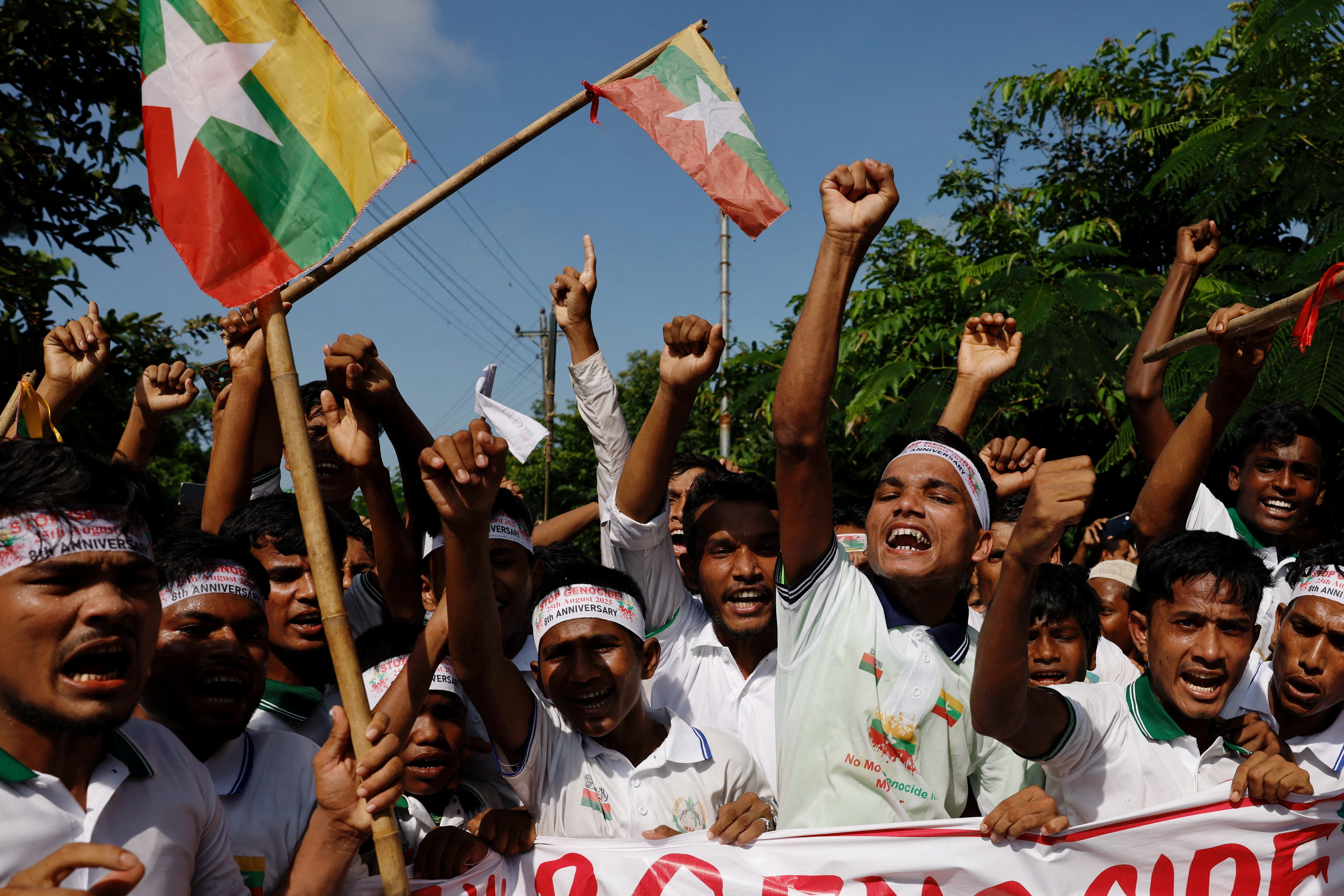 Rohingya refugees chant slogans at a rally in the Cox's Bazar refugee camp, held to mark the eighth anniversary of their exodus from Myanmar, in Bangladesh, August 25, 2025 [Mohammad Ponir Hossain/Reuters]